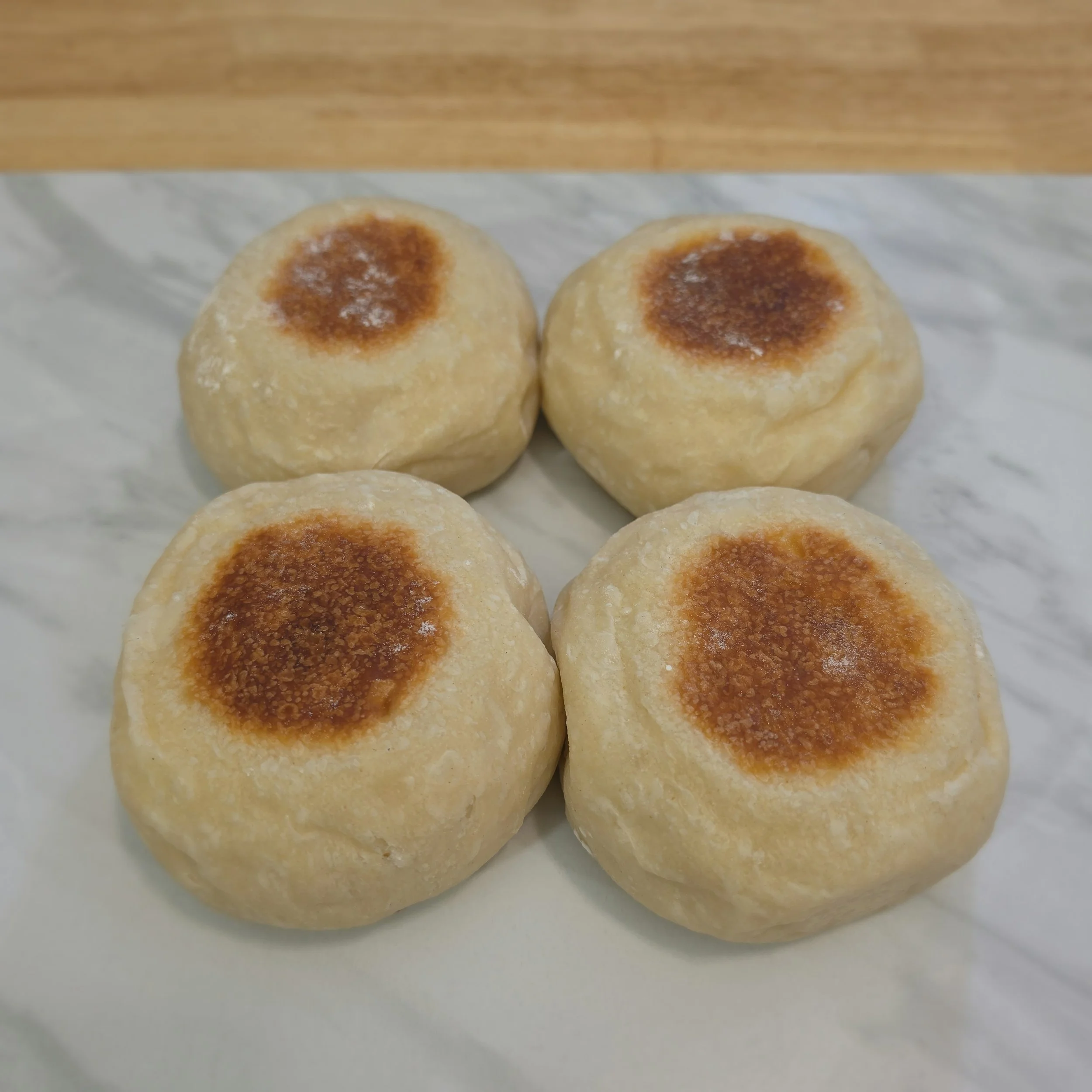 English Muffins: Thick, soft, and chewy — these sourdough English muffins are perfect for breakfast sandwiches or simply with butter and jam.
