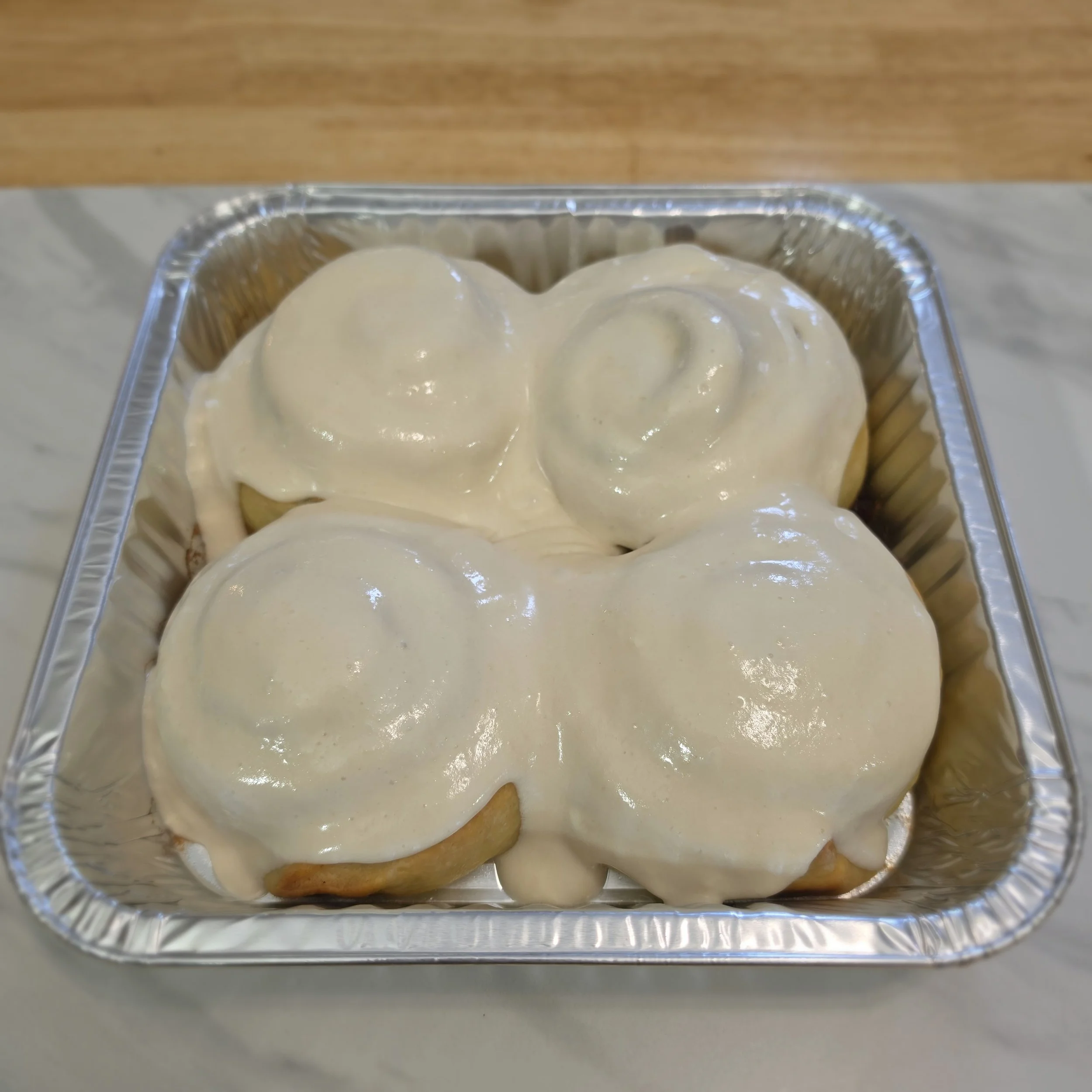 Cinnamon Rolls: Soft and pillowy with that signature sourdough chew, these cinnamon rolls are swirled with warm spice and finished with a generous layer of homemade icing — sweet, gooey, and impossible to resist.