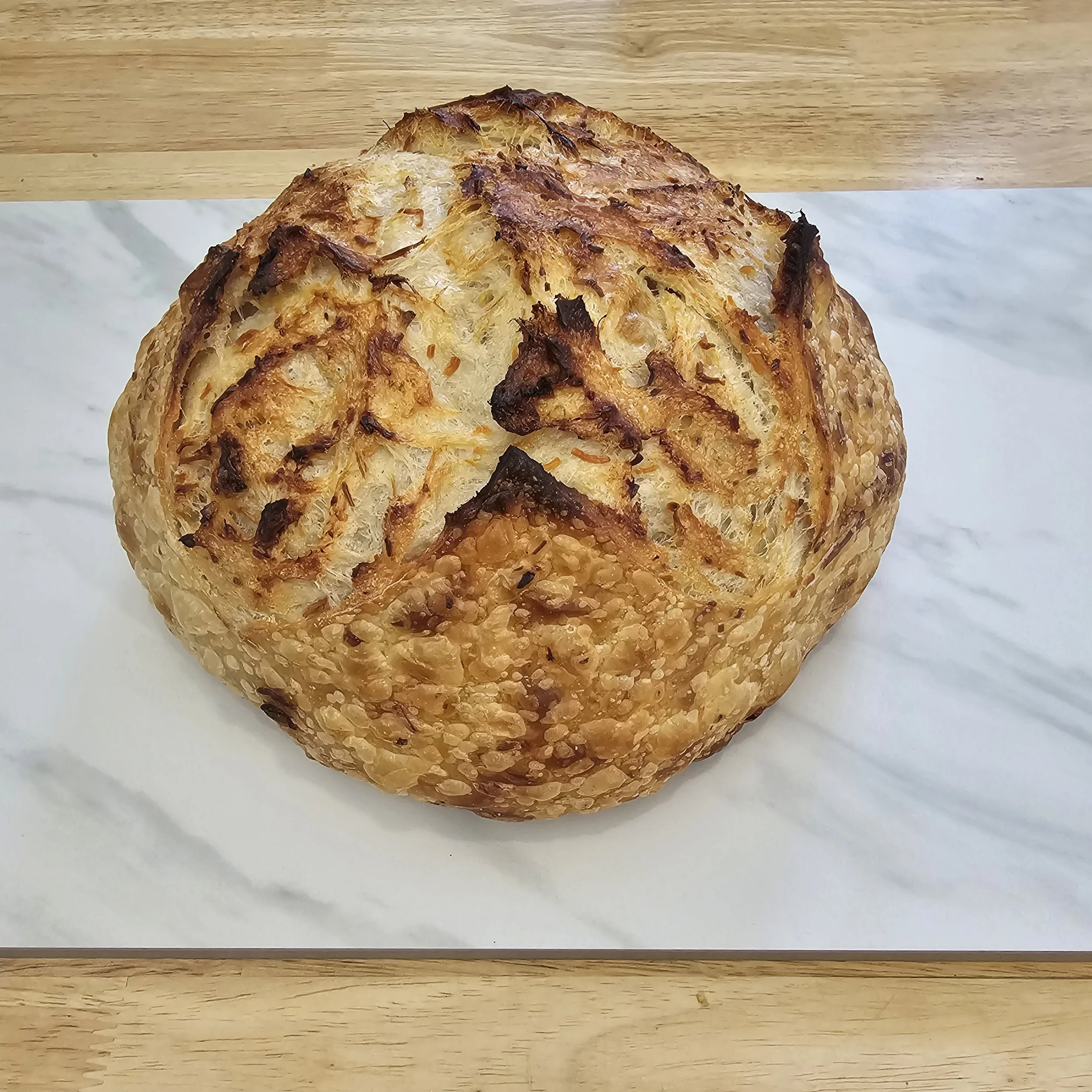 Garlic Parmesan: Our classic sourdough, baked with slow-roasted garlic and freshly grated parmesan for a rich, savory finish.