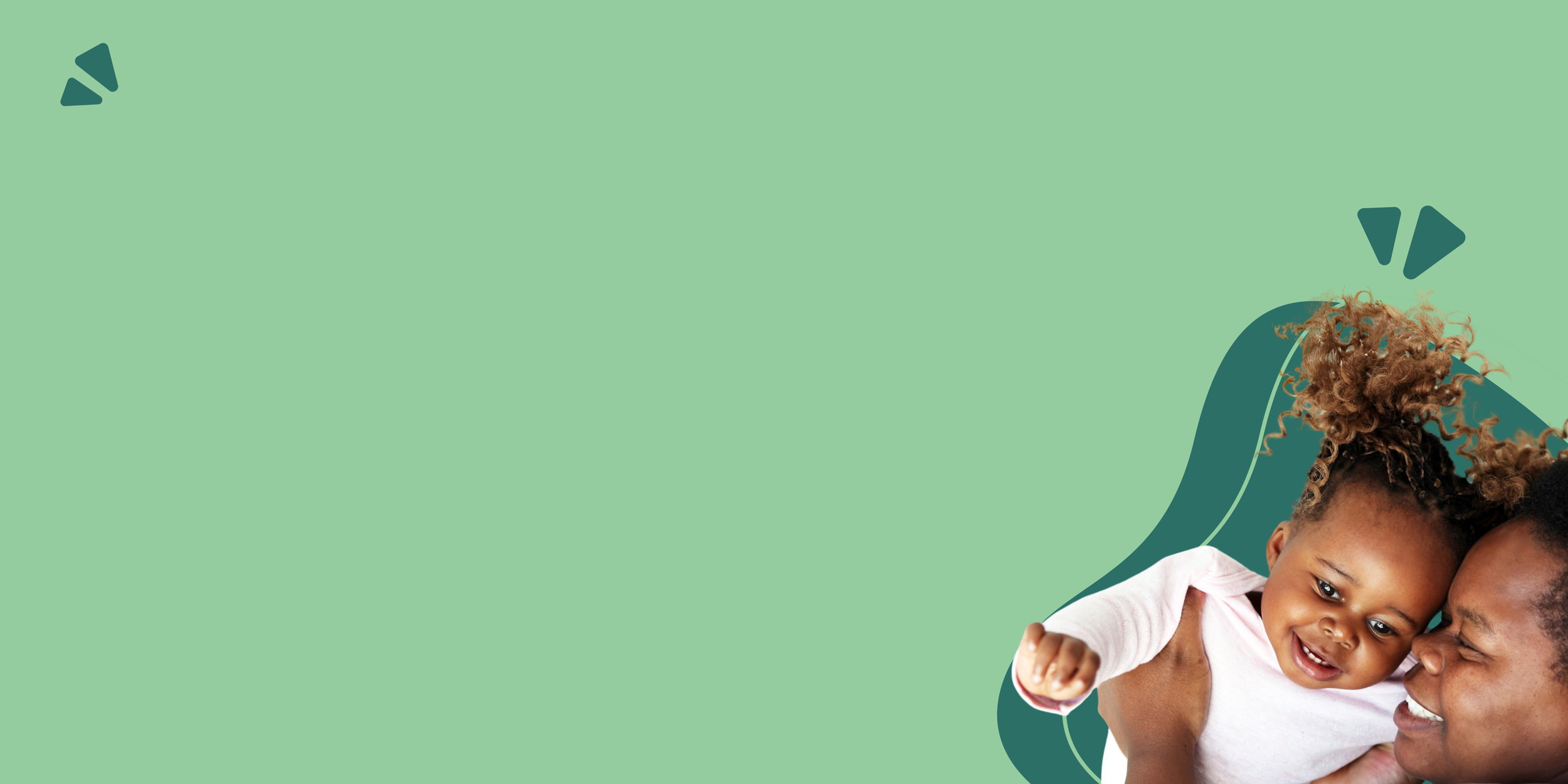 Happy African American mother and daughter smiling and playing together against a green background.