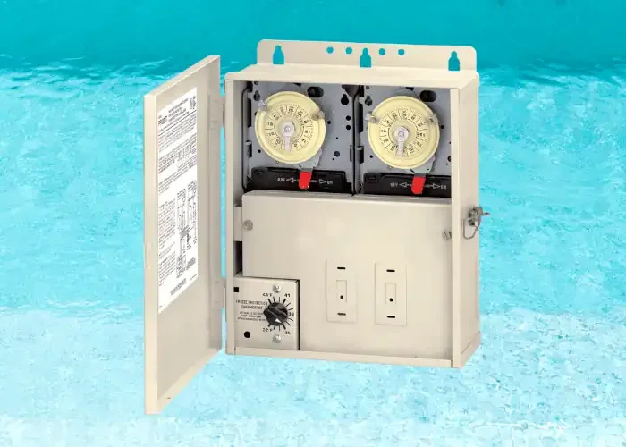 A pool chlorine feeder with two dials inside an open metal case, set against a pool background.