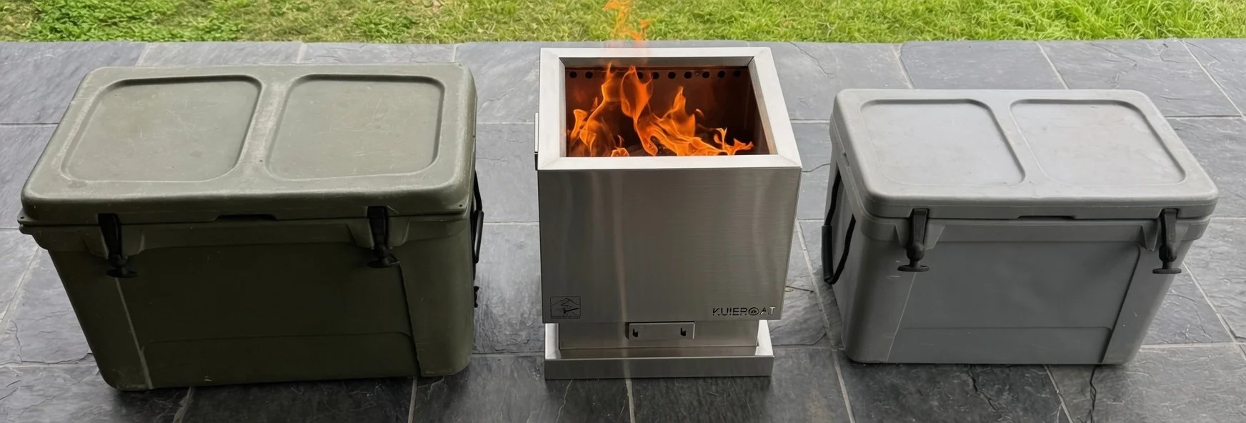 Two outdoor coolers and a fireplace with flames on a patio.