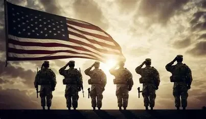 Veterans saluting in front of an American flag, representing veteran‑owned business values.