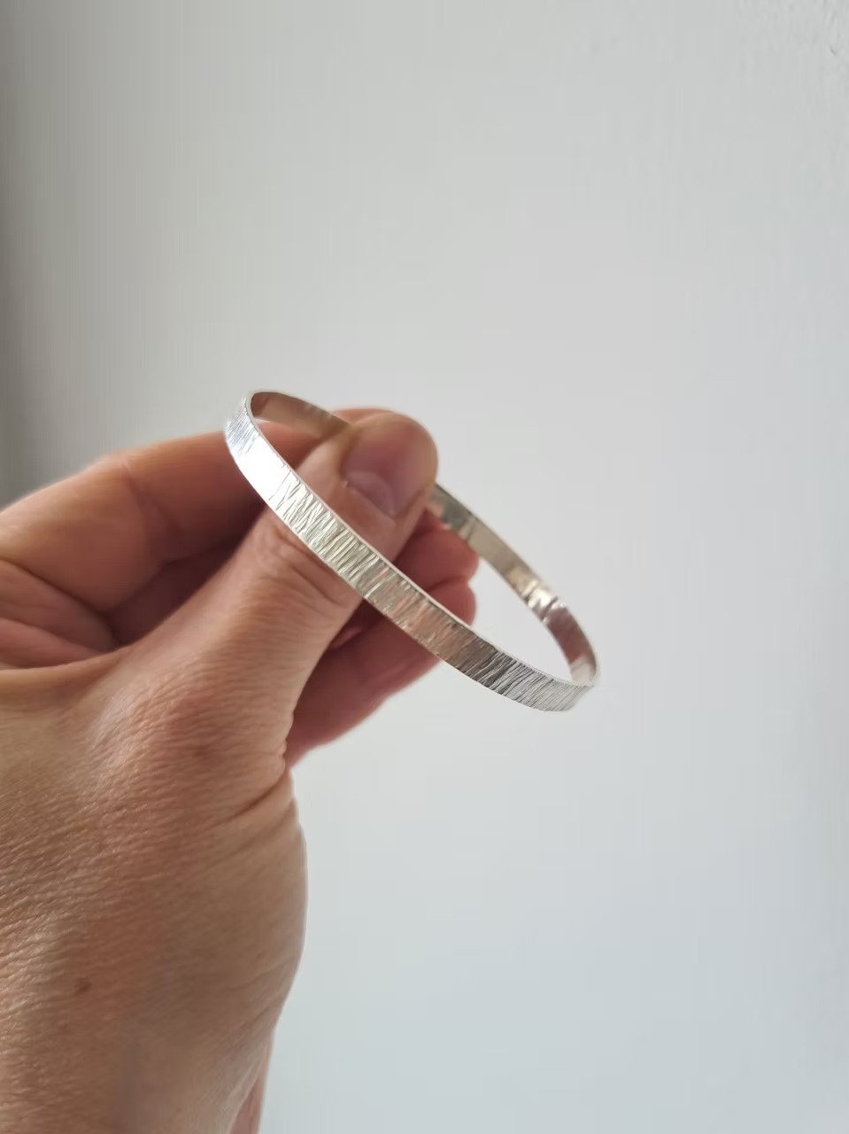 Shadow and Line Silver Unity Bangle.jpg