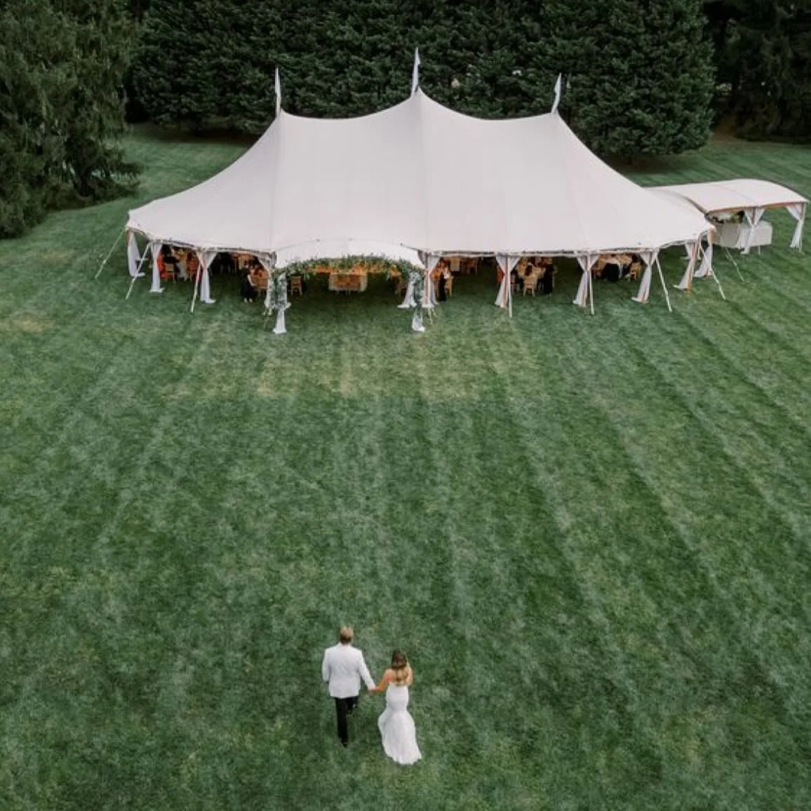 This is not our image (Pinterest) but serves as inspiration and a representation of what our sailcloth tent, bars, rentals and venue will look like. Coming Spring 2026!