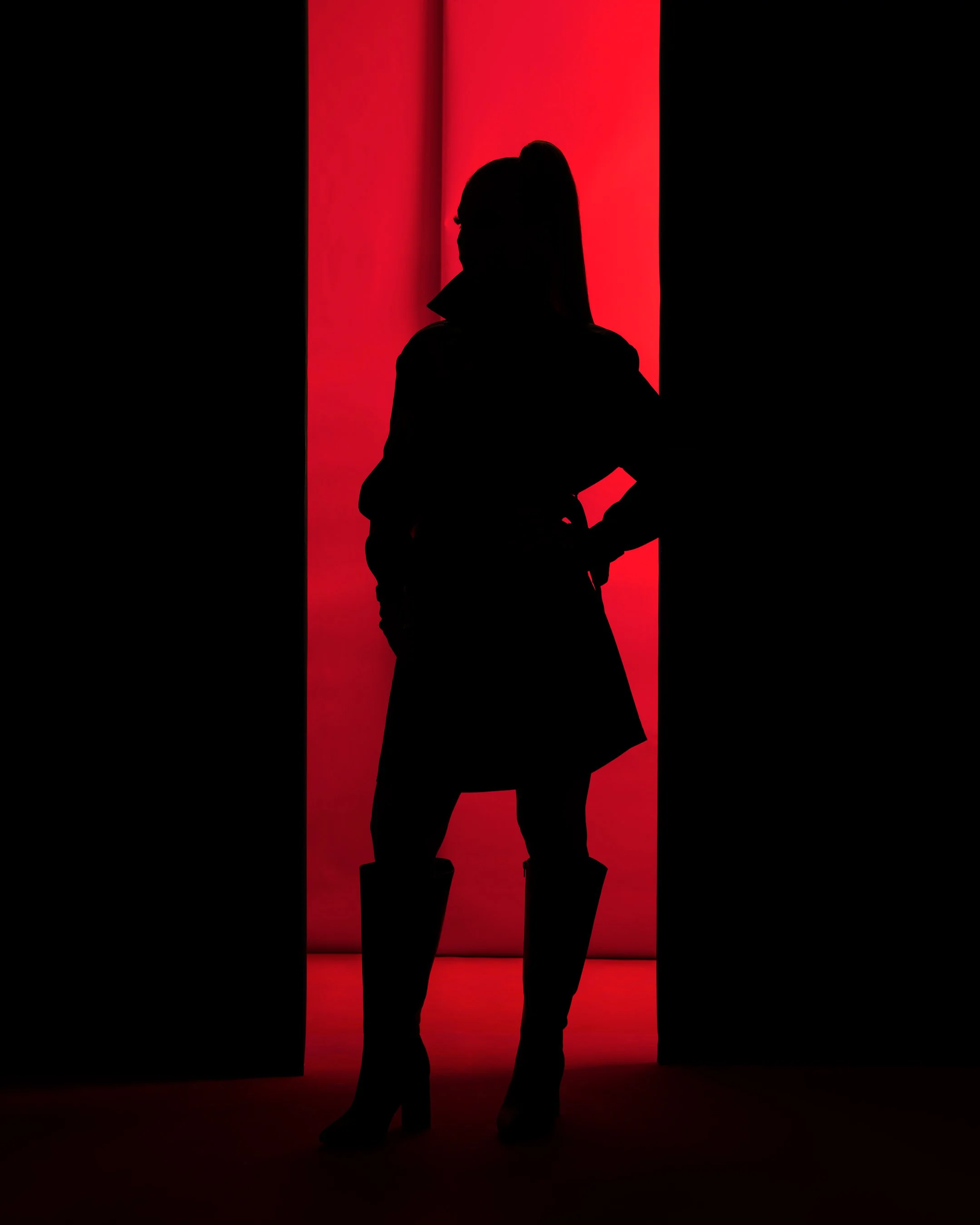 crimson authority fashion editorial by Peter lovit black silhouette  crimson backdrop 