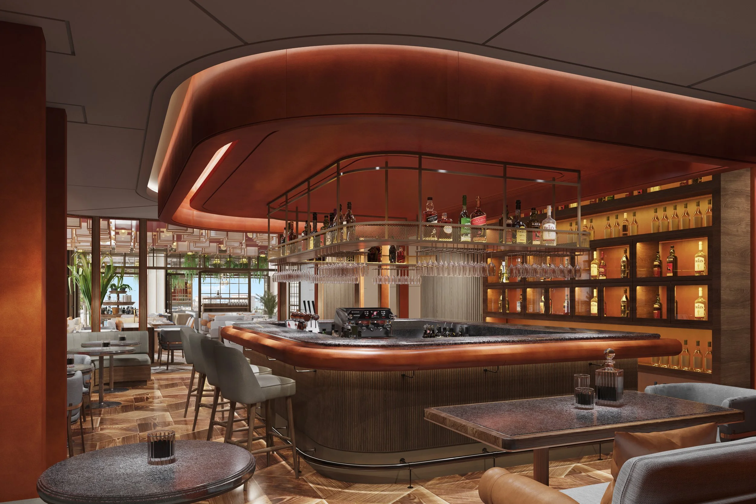 Upscale bar area with circular wooden bar counter, shelves with liquor bottles behind, hanging wine glasses above, modern seating, and large windows with plants inside, in a stylish restaurant