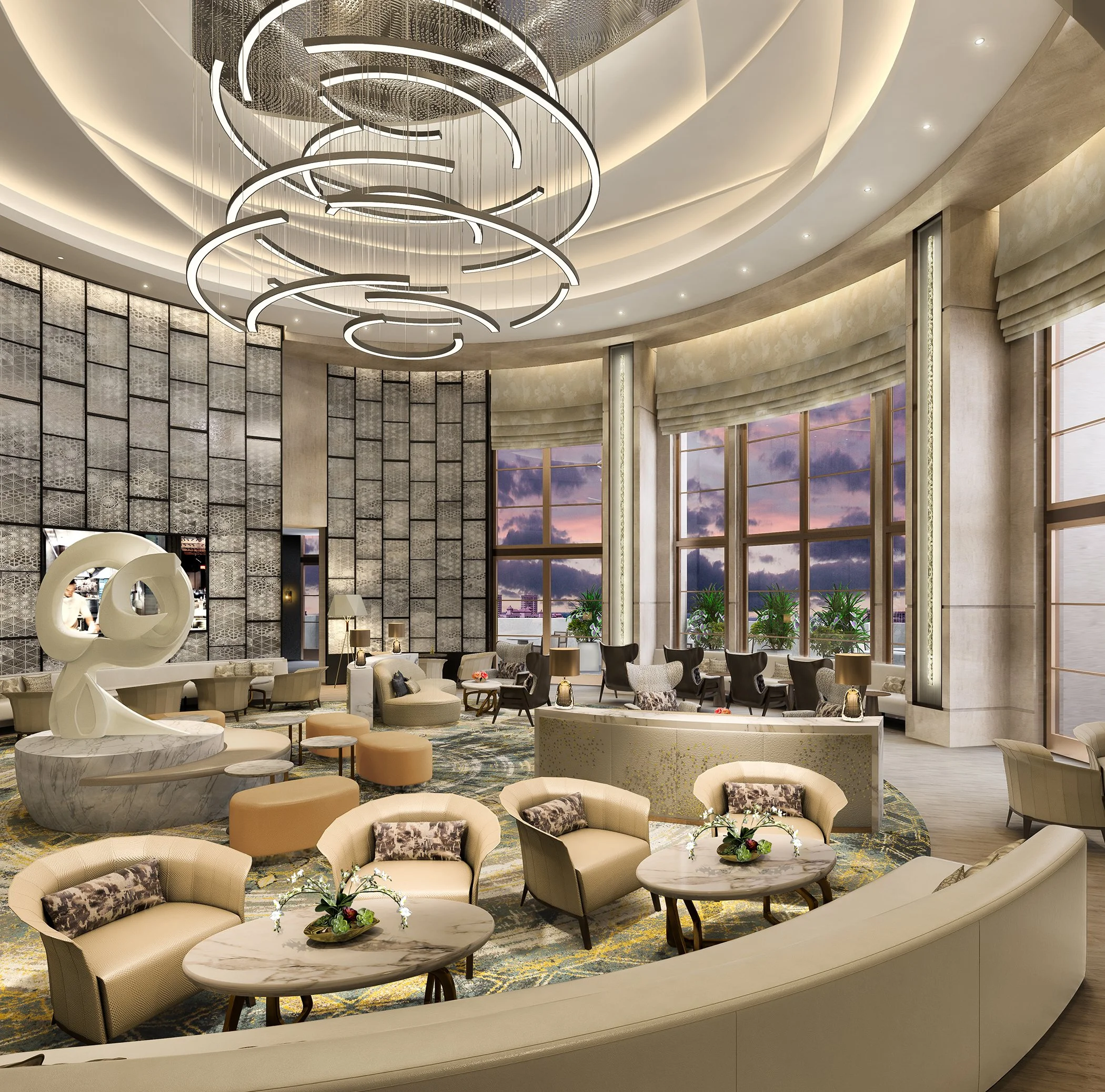 Elegant hotel lobby with modern circular chandelier, large windows showing a sunset sky, plush beige seating with cushions, marble tables, and decorative plants.