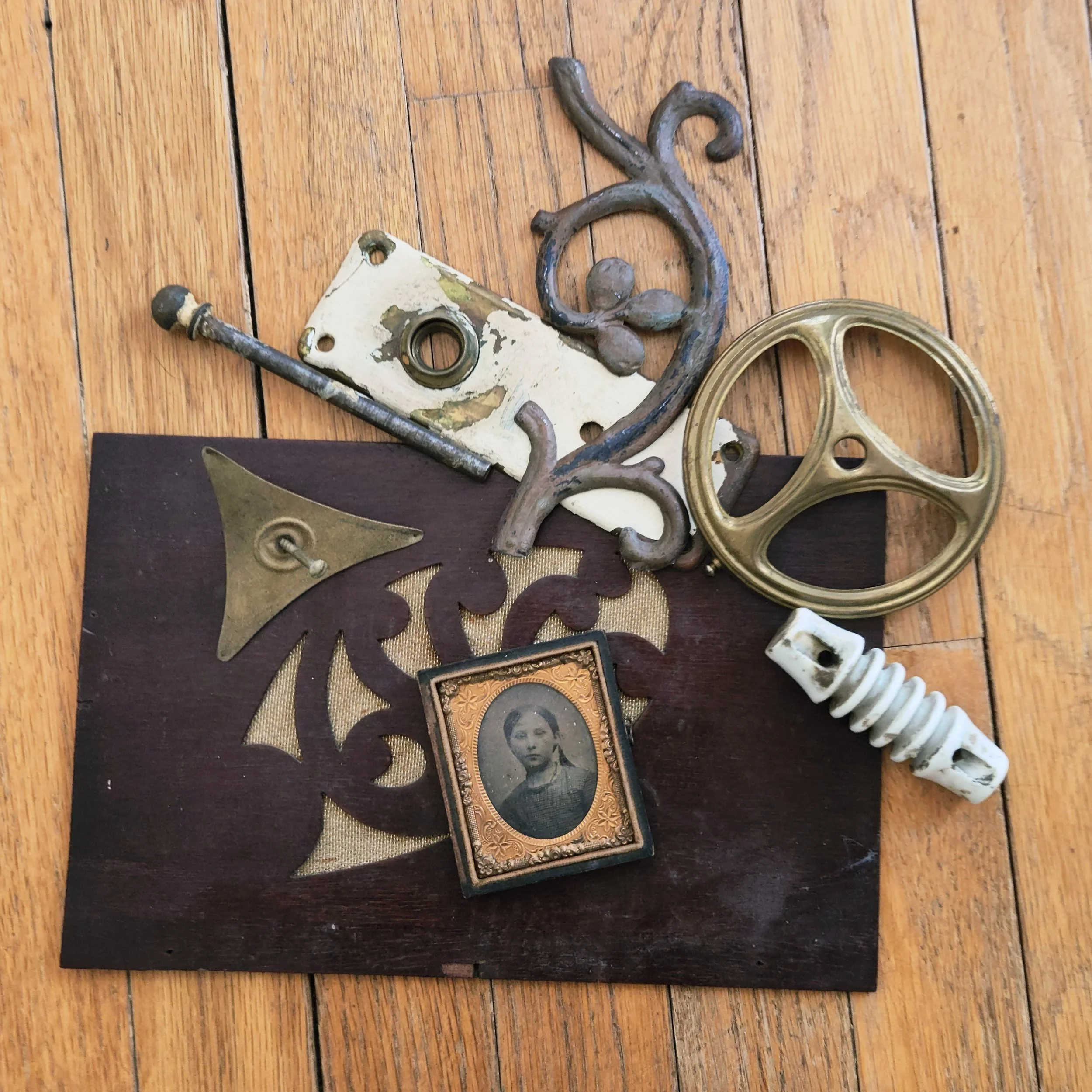 Assorted vintage objects and salvaged materials collected for future assemblage artwork, including hardware, ephemera, and found treasures.