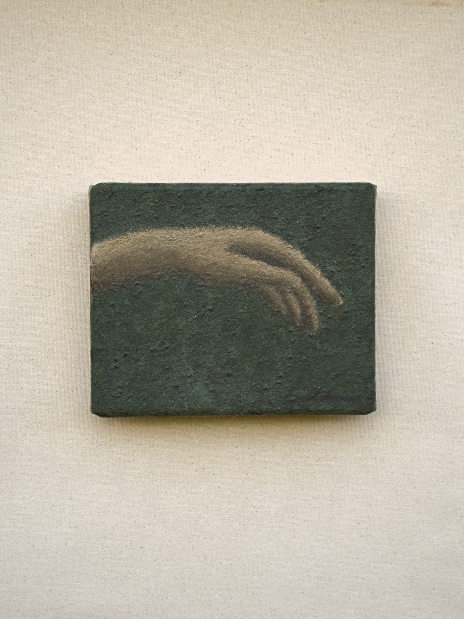 Je – L’air by Emilia Lemaire, 2026. A pale forearm and hand in salt, reaching in from the left and hanging loosely, on a deep green, salt-textured ground.