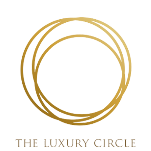 A logo featuring three interlocked golden rings with a green circle inside, and the words "The Luxury Circle" written below.