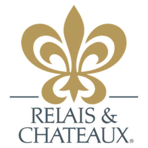 A golden fleur-de-lis symbol with a purple Fleur de Lis logo and text that reads "Scout Leaders".