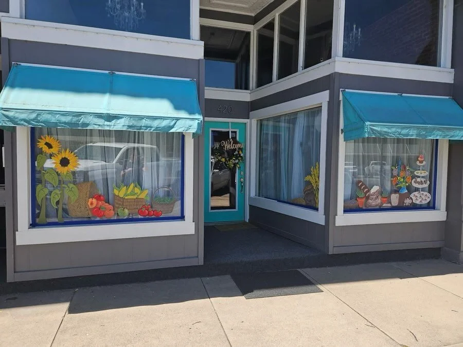 The Tiny Mural Project volunteers have finished the windows at Market Street Mercantile! Big thanks to our crew: MCHS art students Lana and Colbie Heinrich and Murals + Art team members Laurel Thomas and Coleman Stevenson. Come by in person and see t