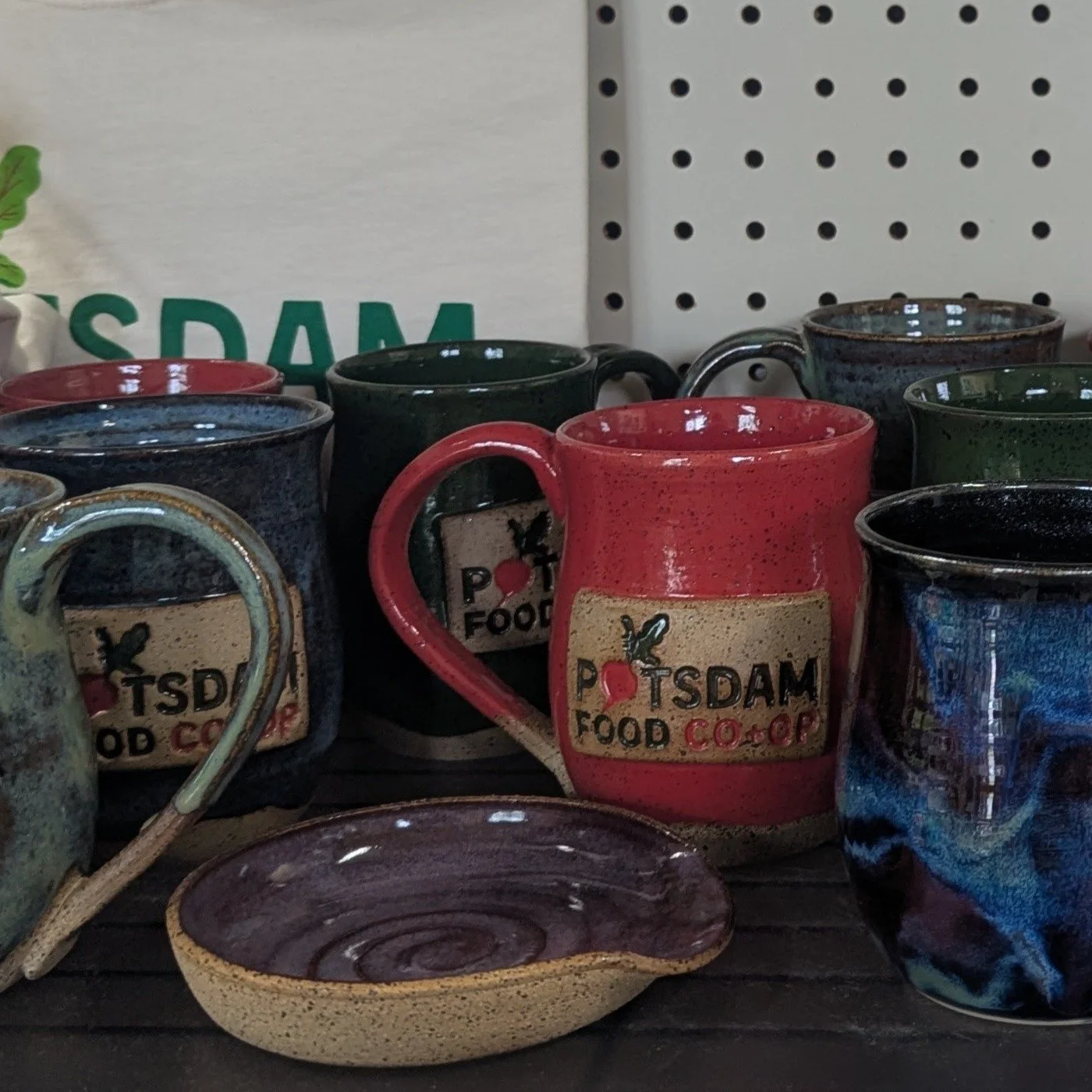 The latest drop from @wildearthwheelworks is out and ready to come home with you!!! Stop by the Co-op and grab one of our custom Co+op mugs, or another of Lauren's beautiful creations. There is even a spoon rest and one of her very popular Northern L