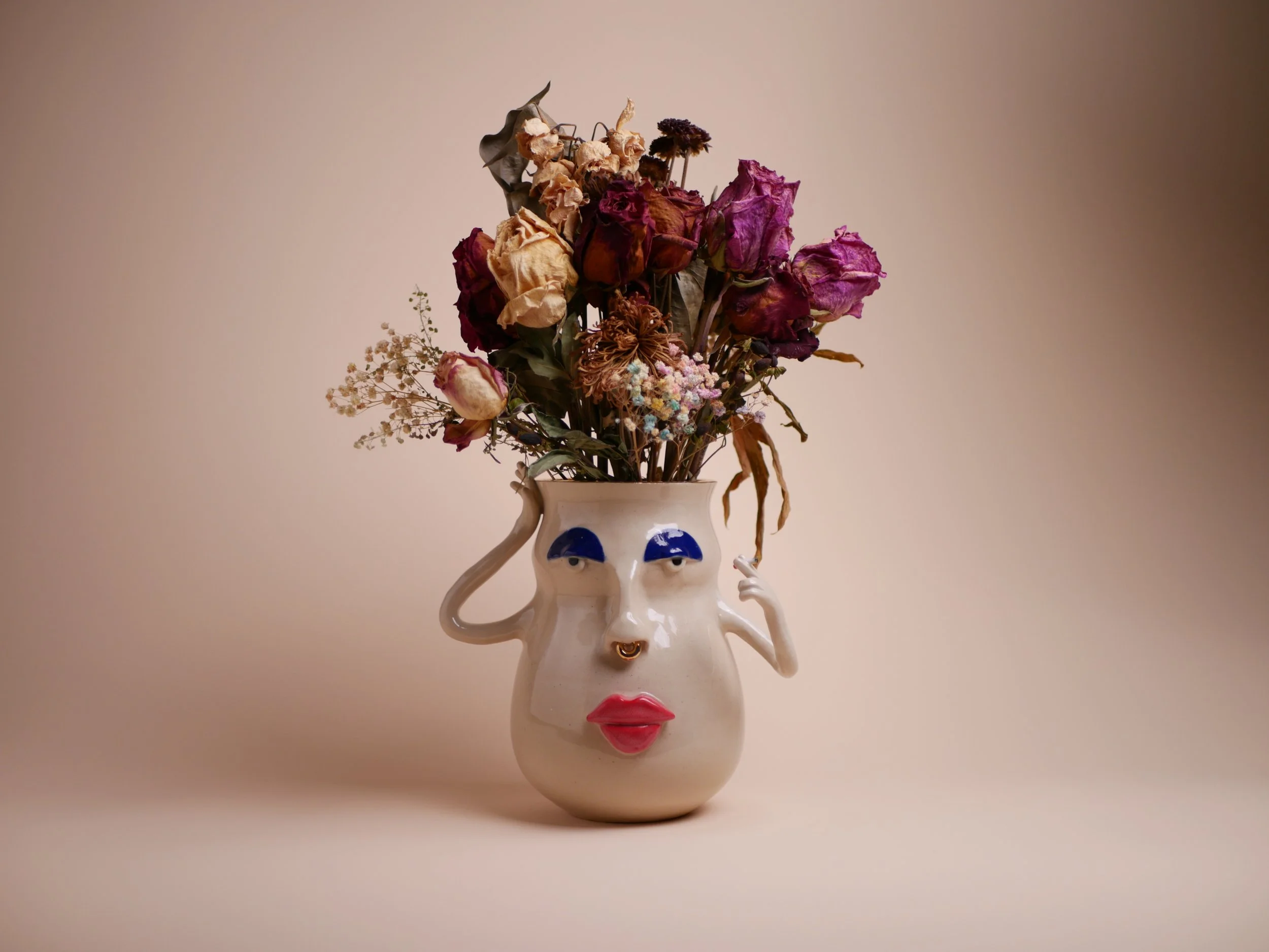 La Cara de F.art Smoking a Cigar