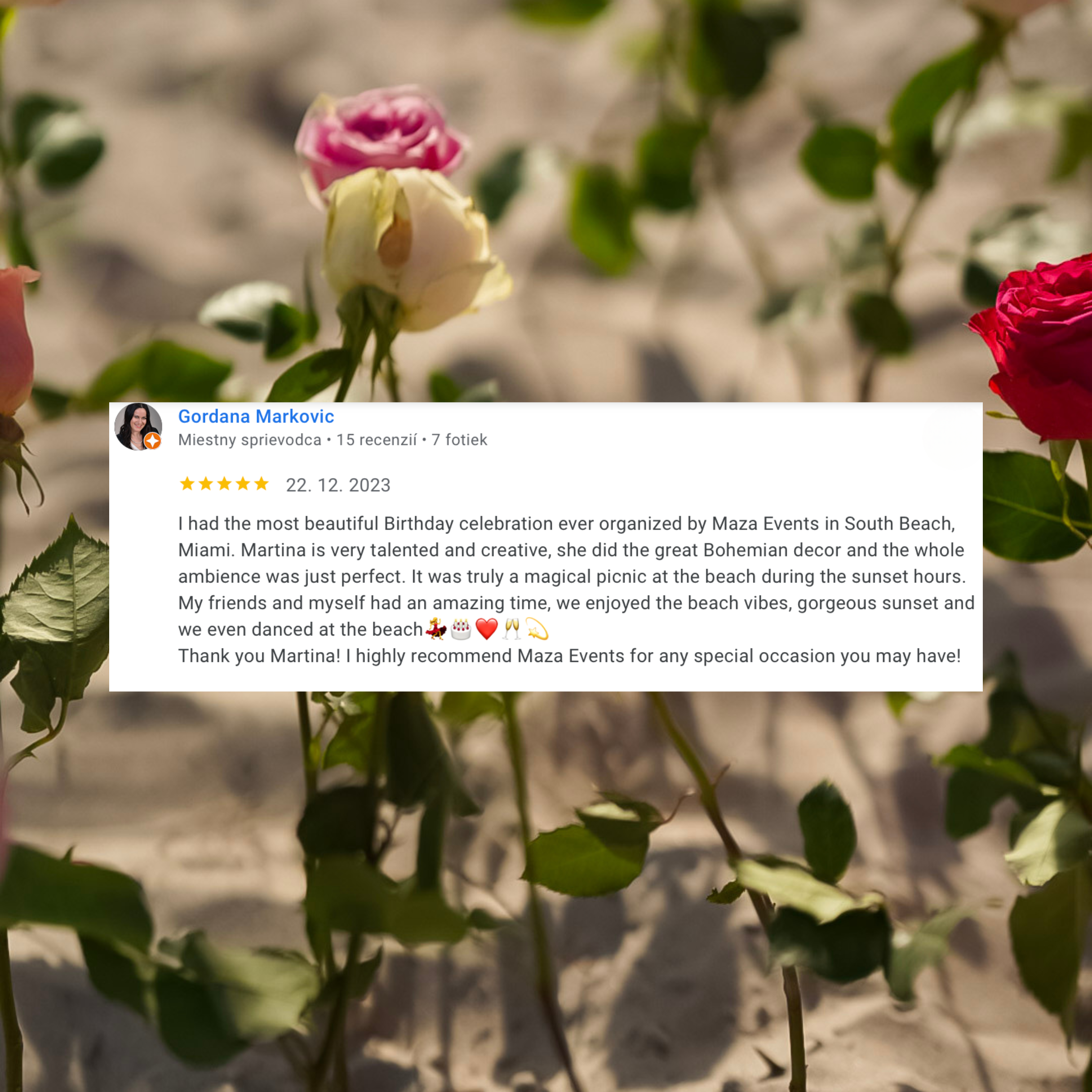 A review overlaid on an image of pink, white, and red roses on a sandy beach.