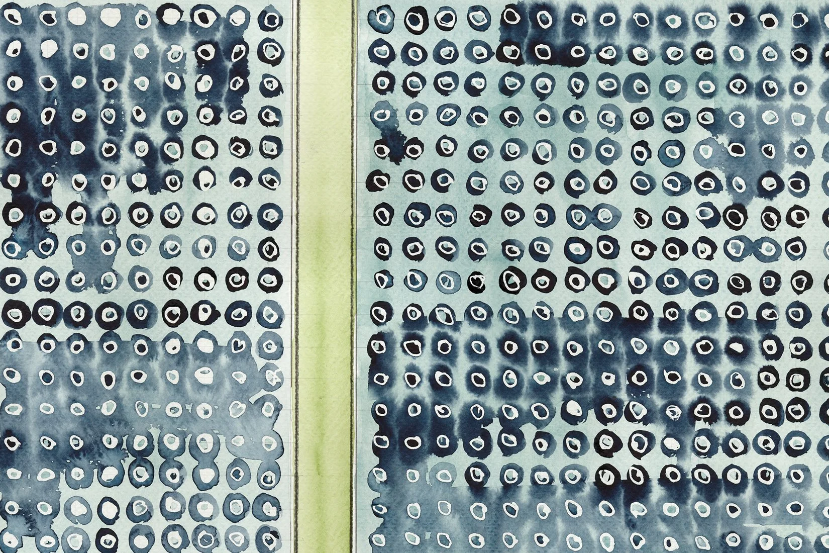 A close-up of perforated metal sheets with circular holes, painted in shades of blue and black, separated by a light green strip.