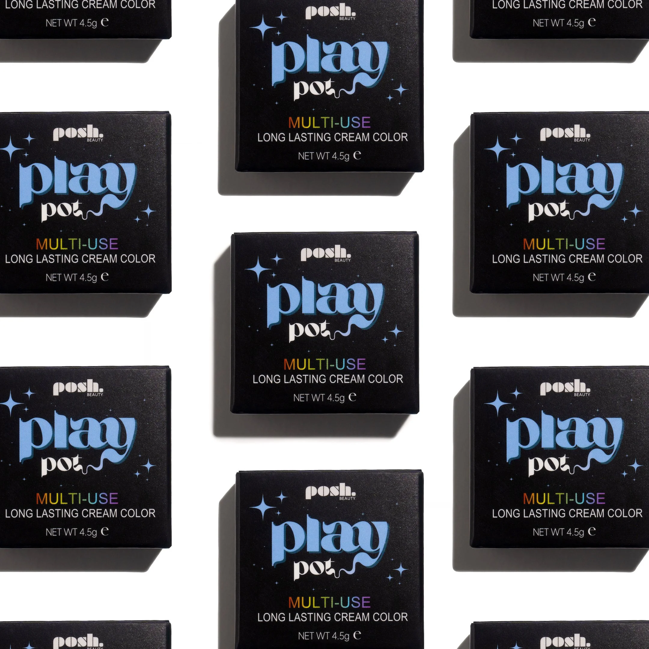 Multiple black boxes of Posh Beauty Play Pot long-lasting cream color with colorful text and star design on each box, arranged in a pattern.