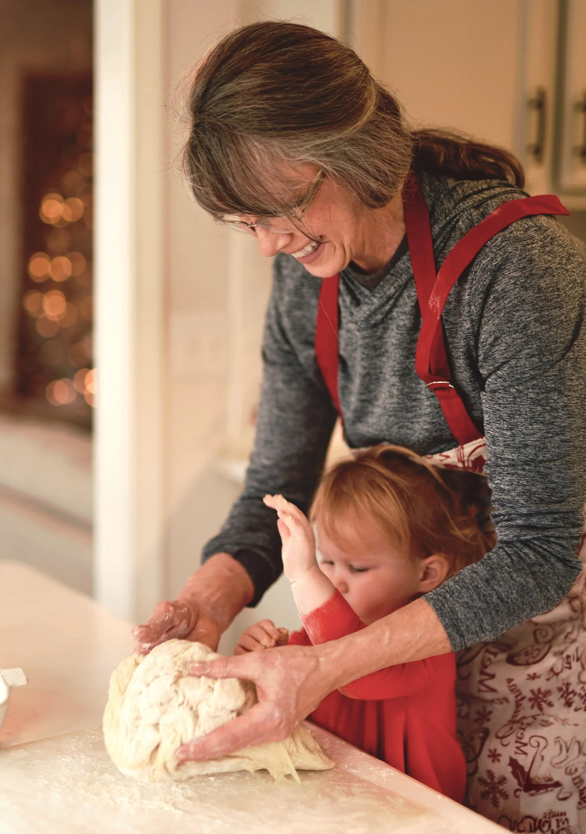 Grandmother and girl baking together