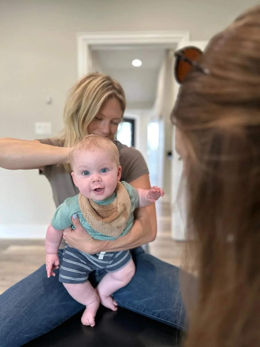 Happy baby patient after reflux chiropractic care at Social House Chiropractic in Prosper, TX. Drug-free reflux and colic support.