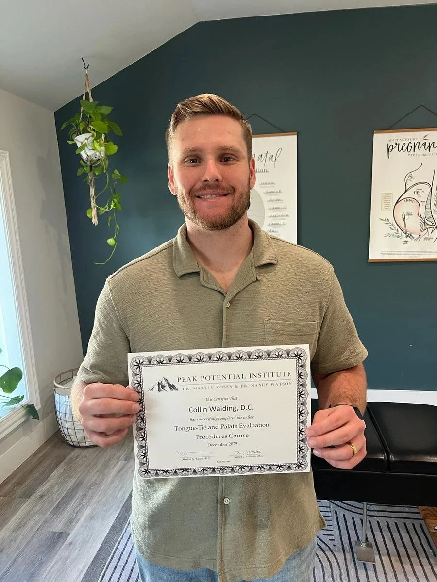 Dr. Collin Walding holding his Peak Potential Institute Tongue-Tie and Palate Evaluation certification. Tongue tie support at Social House Chiropractic in Prosper, TX.