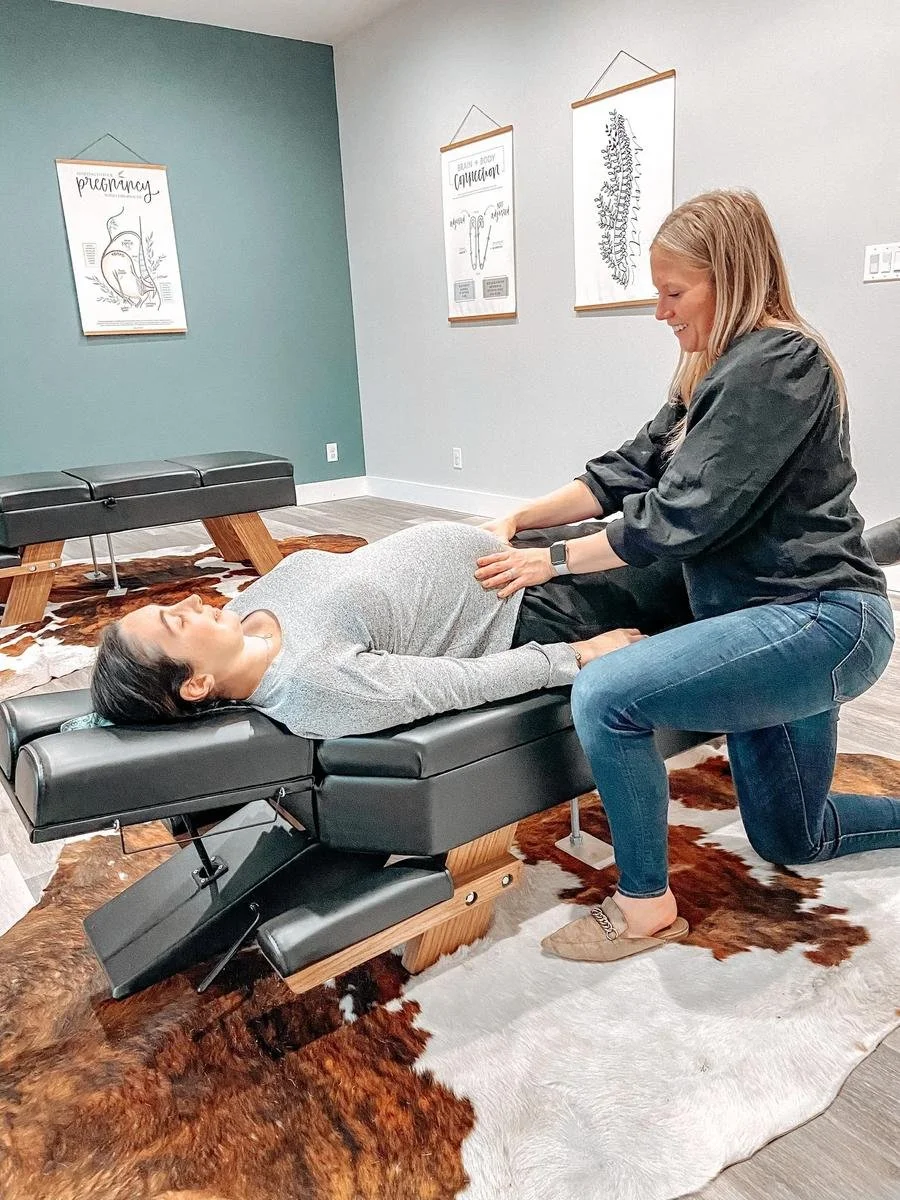 Dr. Kara Rodriguez performing the Webster Technique for breech positioning at Social House Chiropractic in Prosper, TX. Webster Certified prenatal chiropractor.