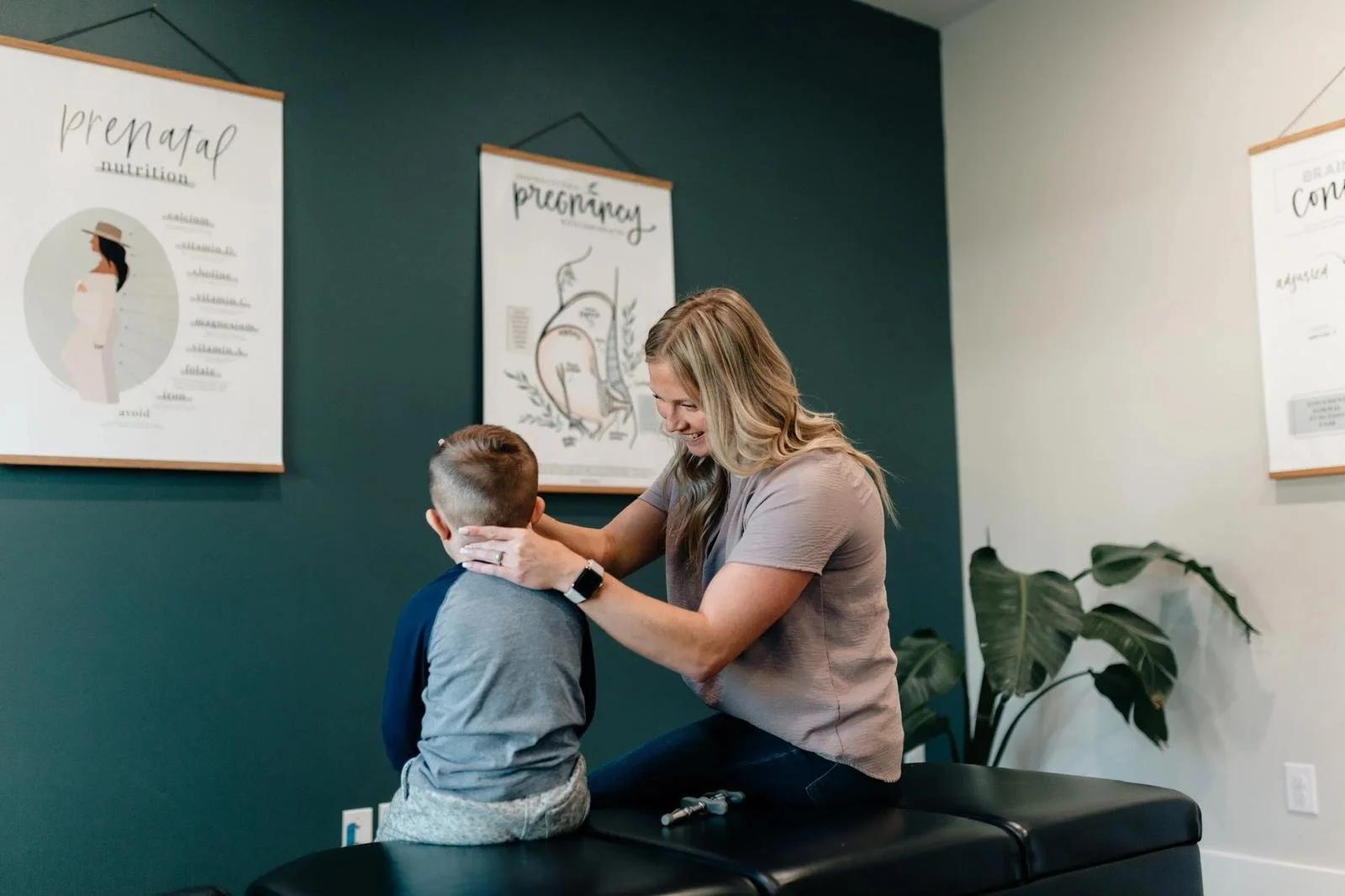 Gentle cervical chiropractic adjustment for school-age children at Social House Chiropractic. Pediatric and family chiropractic care in Prosper, Celina, McKinney, and Frisco.