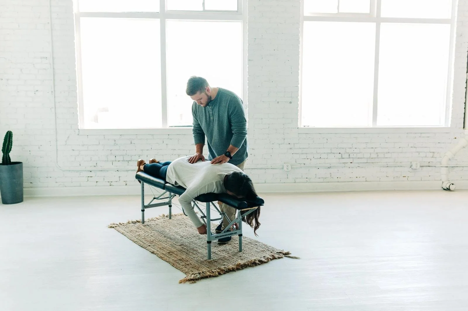 First-visit adult chiropractic adjustment at Social House Chiropractic in Prosper, TX.