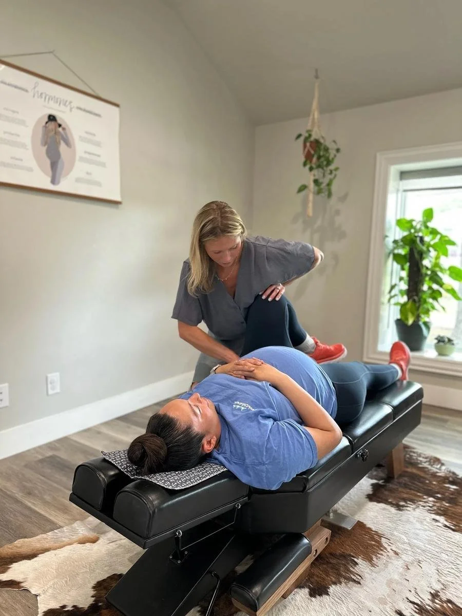 Webster Technique sacral and pelvic adjustment for pregnant women at Social House Chiropractic in Prosper, TX. Webster Certified.