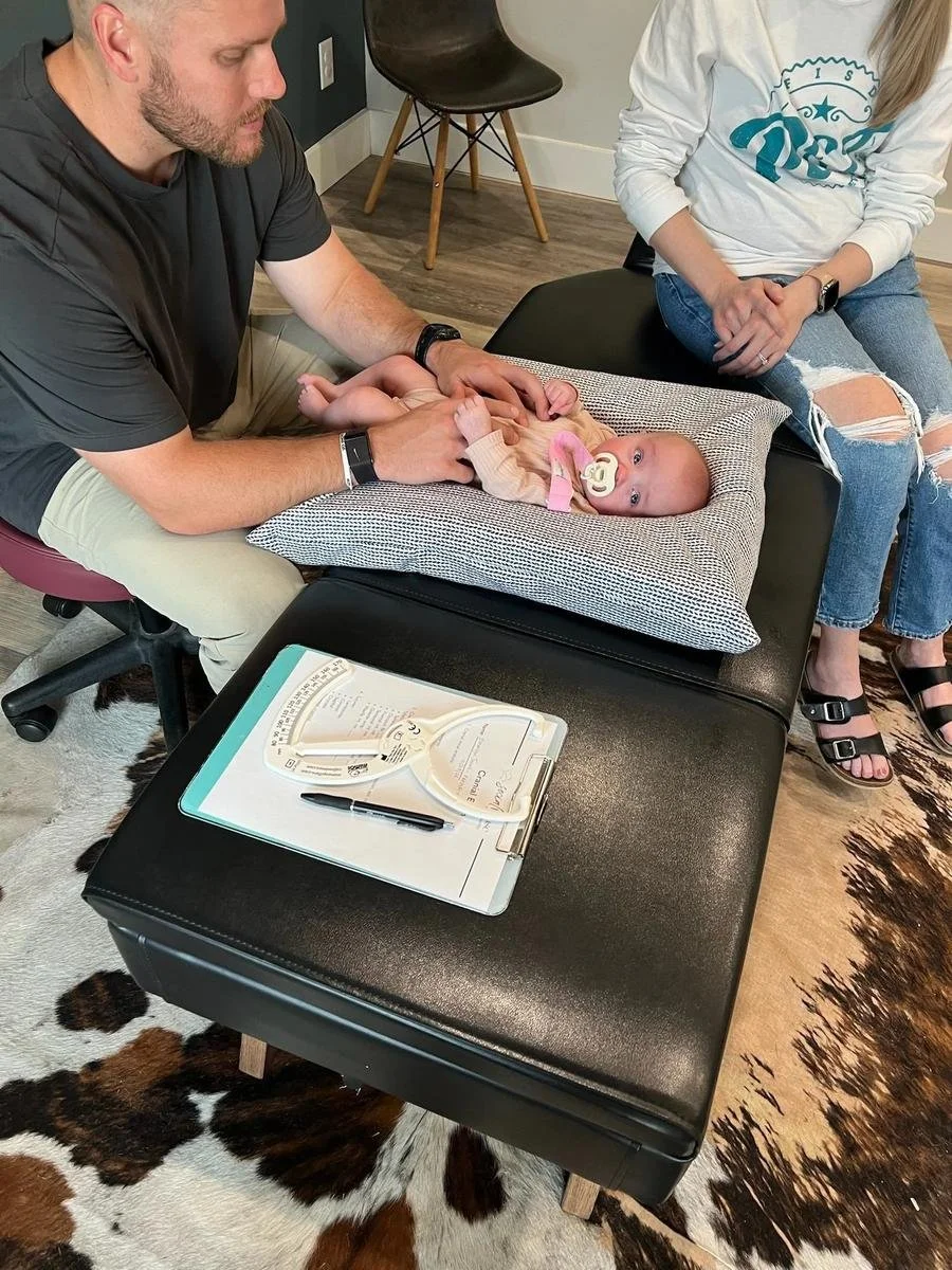 Dr. Collin Walding providing gentle infant chiropractic care to families from Celina, TX. Social House Chiropractic in Prosper specializes in newborn and pediatric chiropractic.
