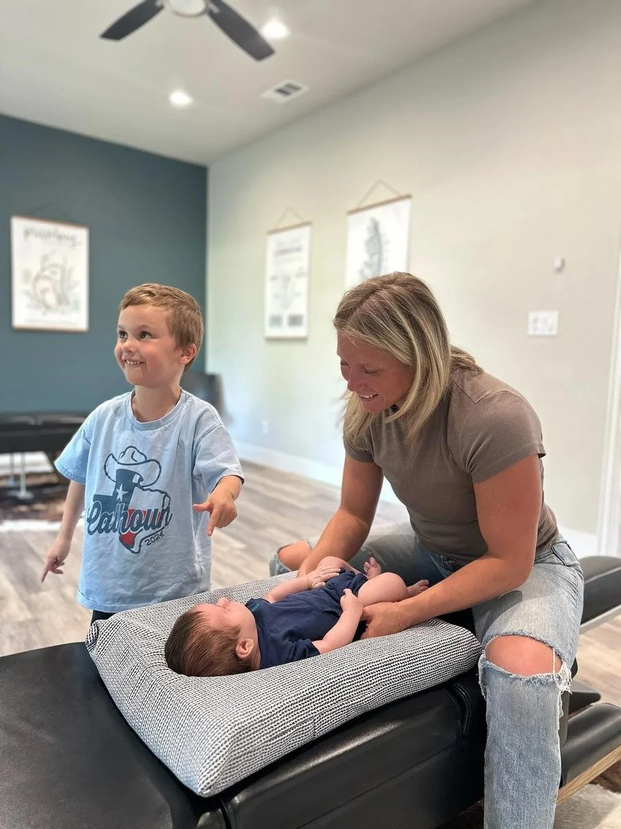 Pediatric neurological assessment and gentle adjustment with siblings welcome at Social House Chiropractic in Prosper, TX.
