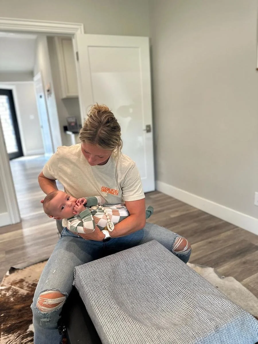 Dr. Kara Rodriguez providing craniosacral support for newborns with tongue tie at Social House Chiropractic in Prosper, TX.