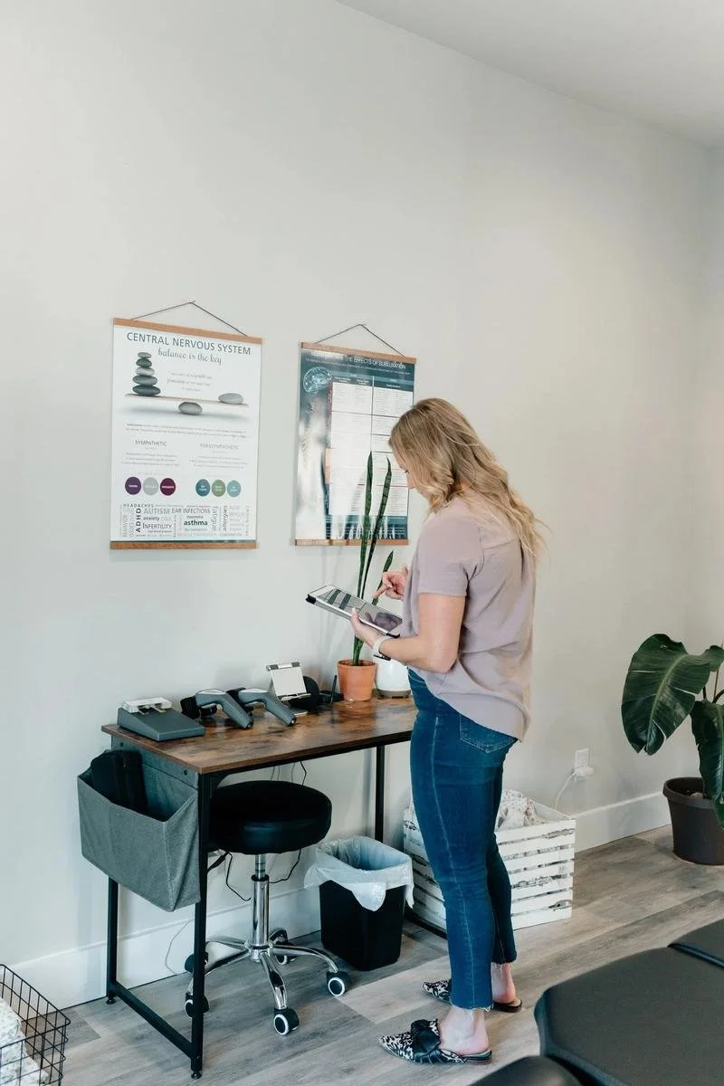 Dr. Kara conducting an INSiGHT neurological spinal exam at Social House Chiropractic in Prosper, TX. Objective assessment of nervous system function.