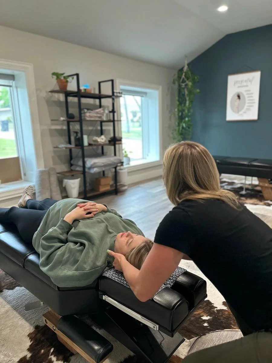 Adult drop-table cervical chiropractic adjustment for migraine and headache relief at Social House Chiropractic in Prosper, TX.