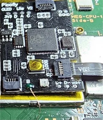 RP2040 Picofly modchip installed on a Nintendo Switch motherboard