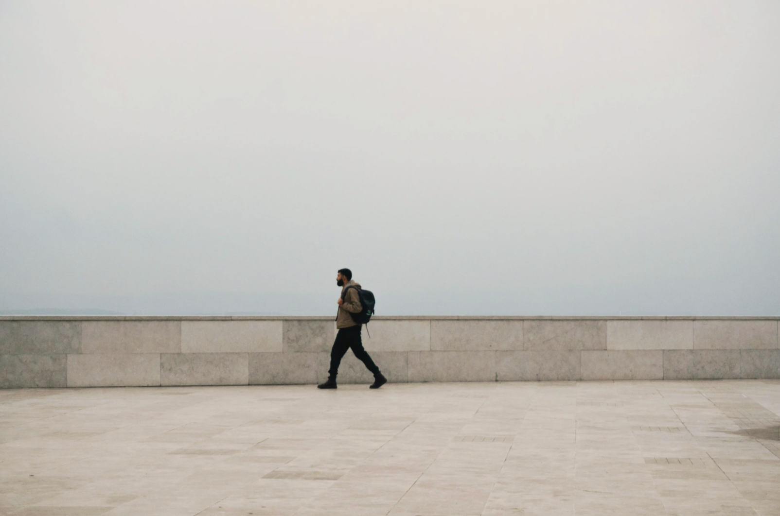 Man walking alone outdoors, representing moving forward through therapy and personal change
