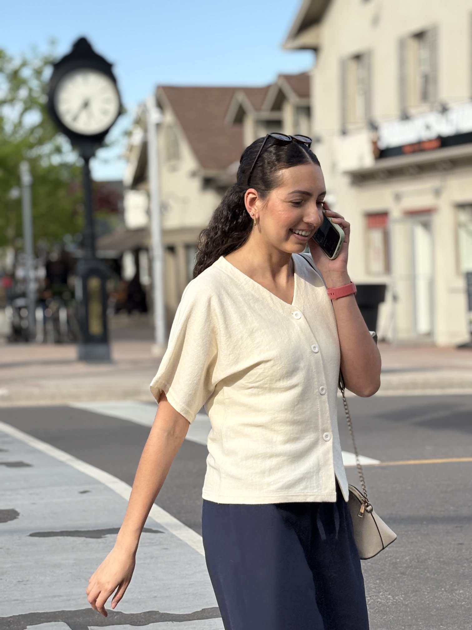 Women’s ivory V-neck blouse with a relaxed fit and soft, flowy silhouette
