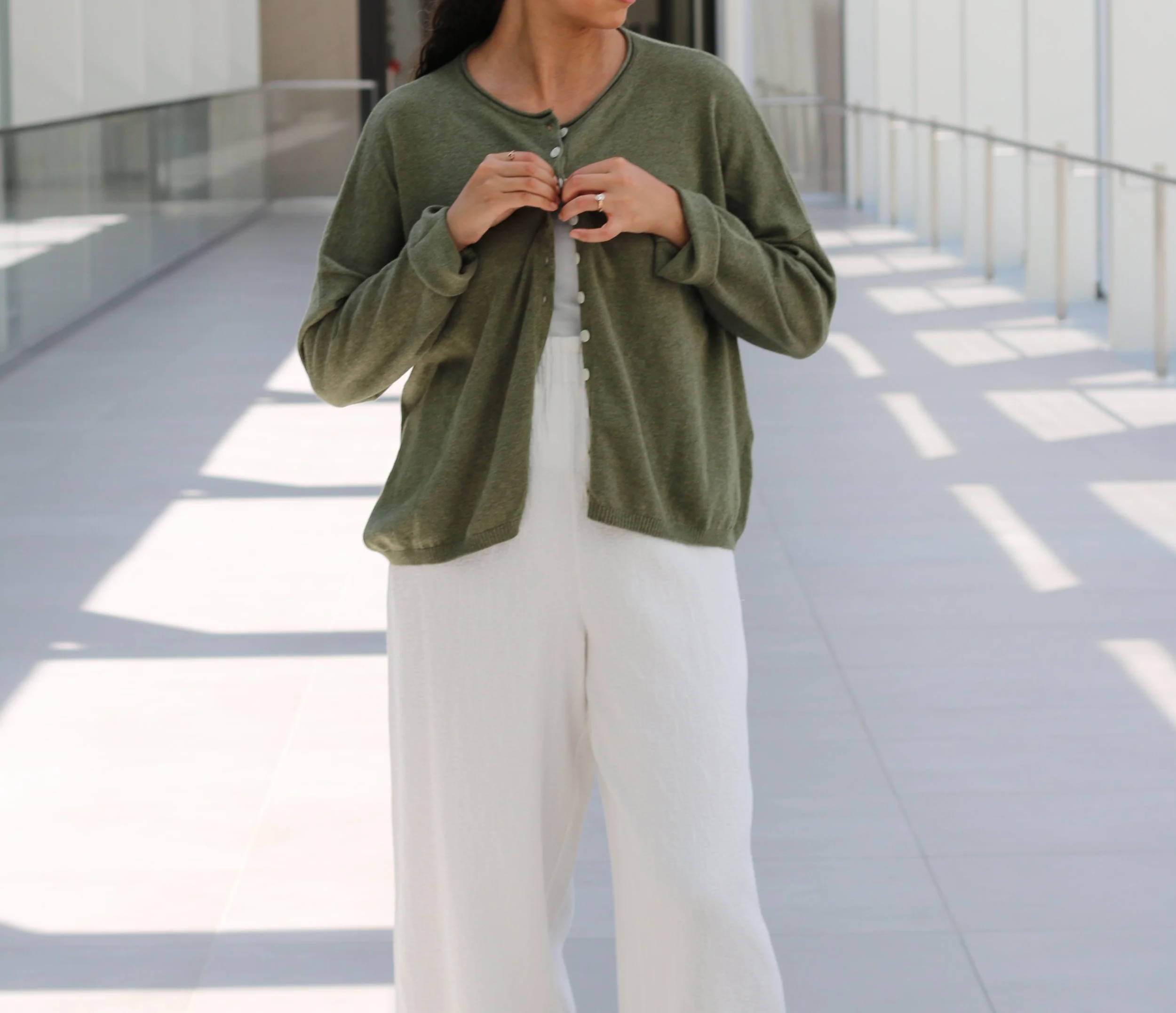 Olive green boxy-fit women’s knit cardigan, loose relaxed fit, made from sustainable wool and cotton blend