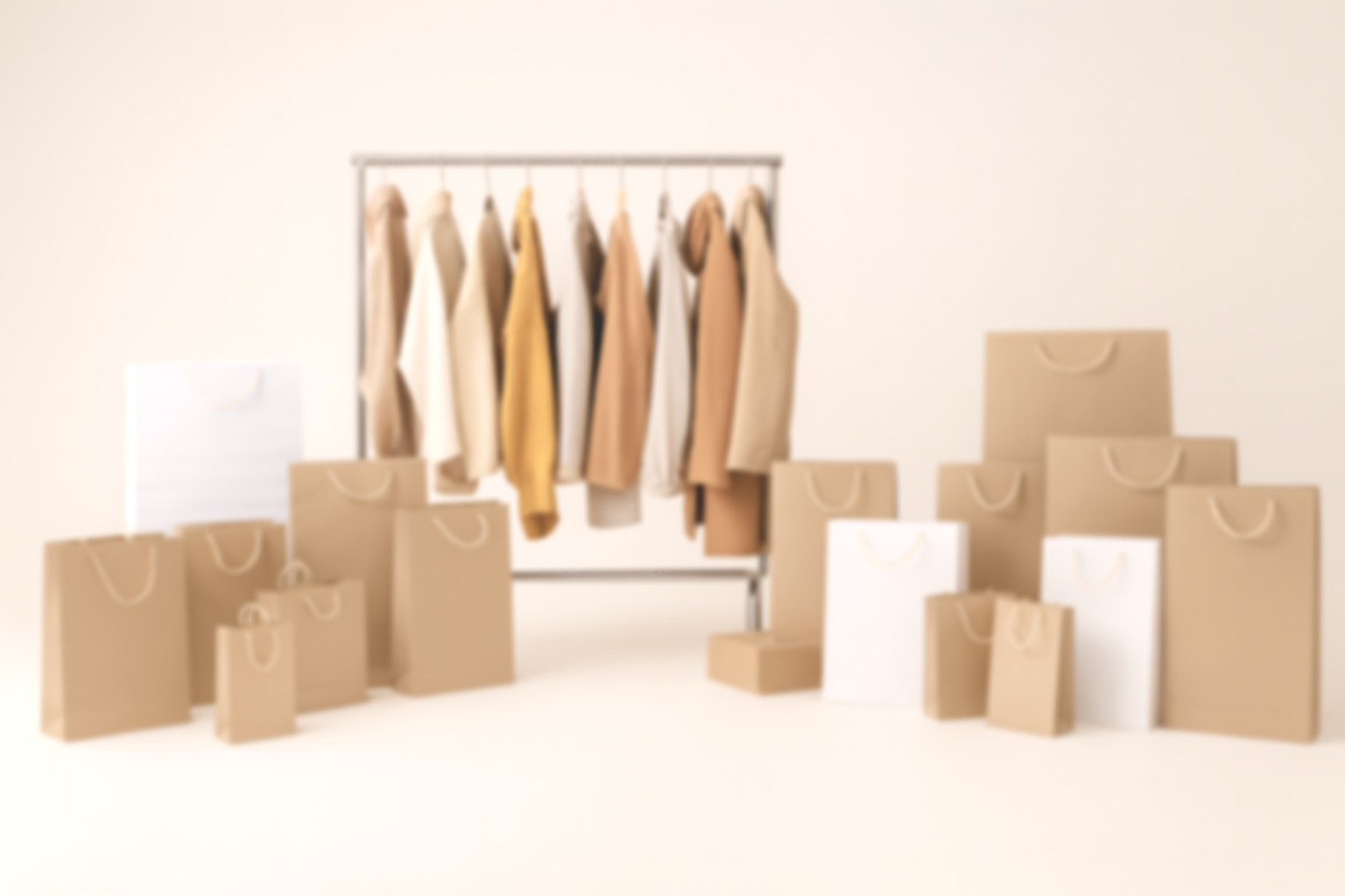 Various paper shopping bags arranged in front of a clothing rack with beige and white garments