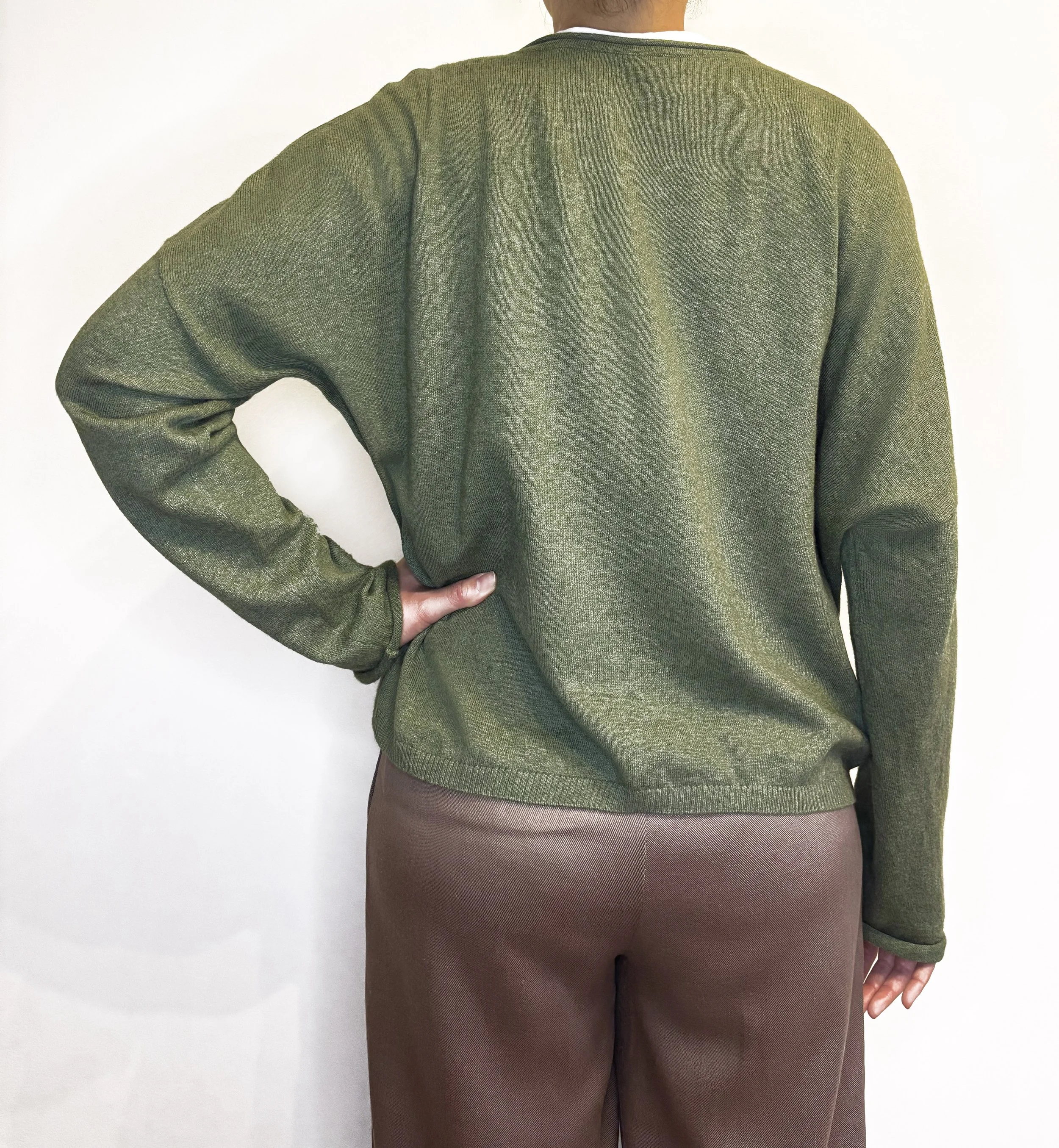 Olive green boxy-fit women’s knit cardigan, loose relaxed fit, made from sustainable wool and cotton fibres