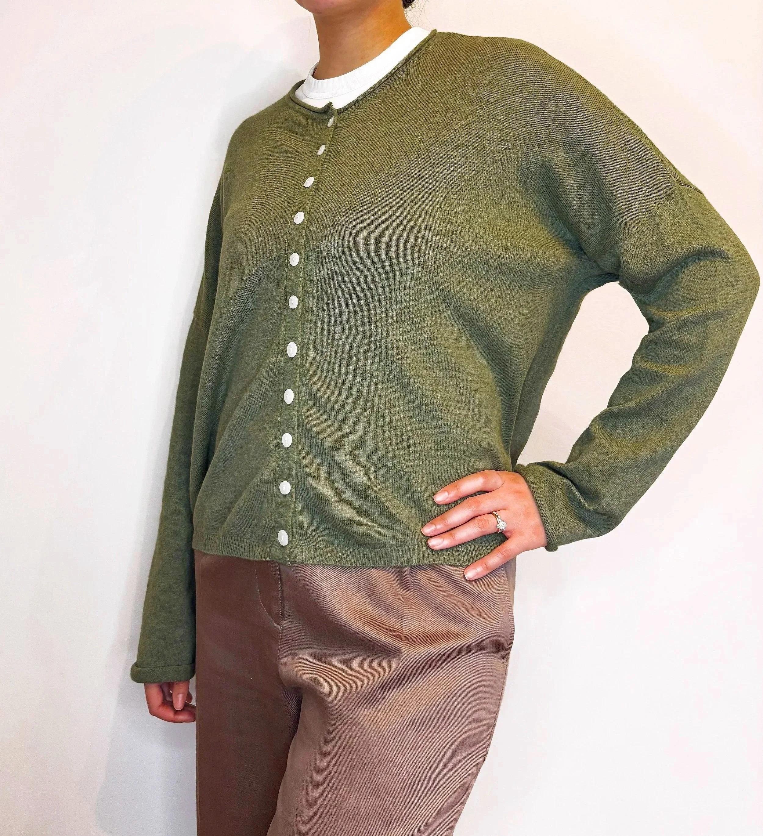 Olive green boxy-fit women’s knit cardigan, loose relaxed fit, made from sustainable wool and cotton fibres