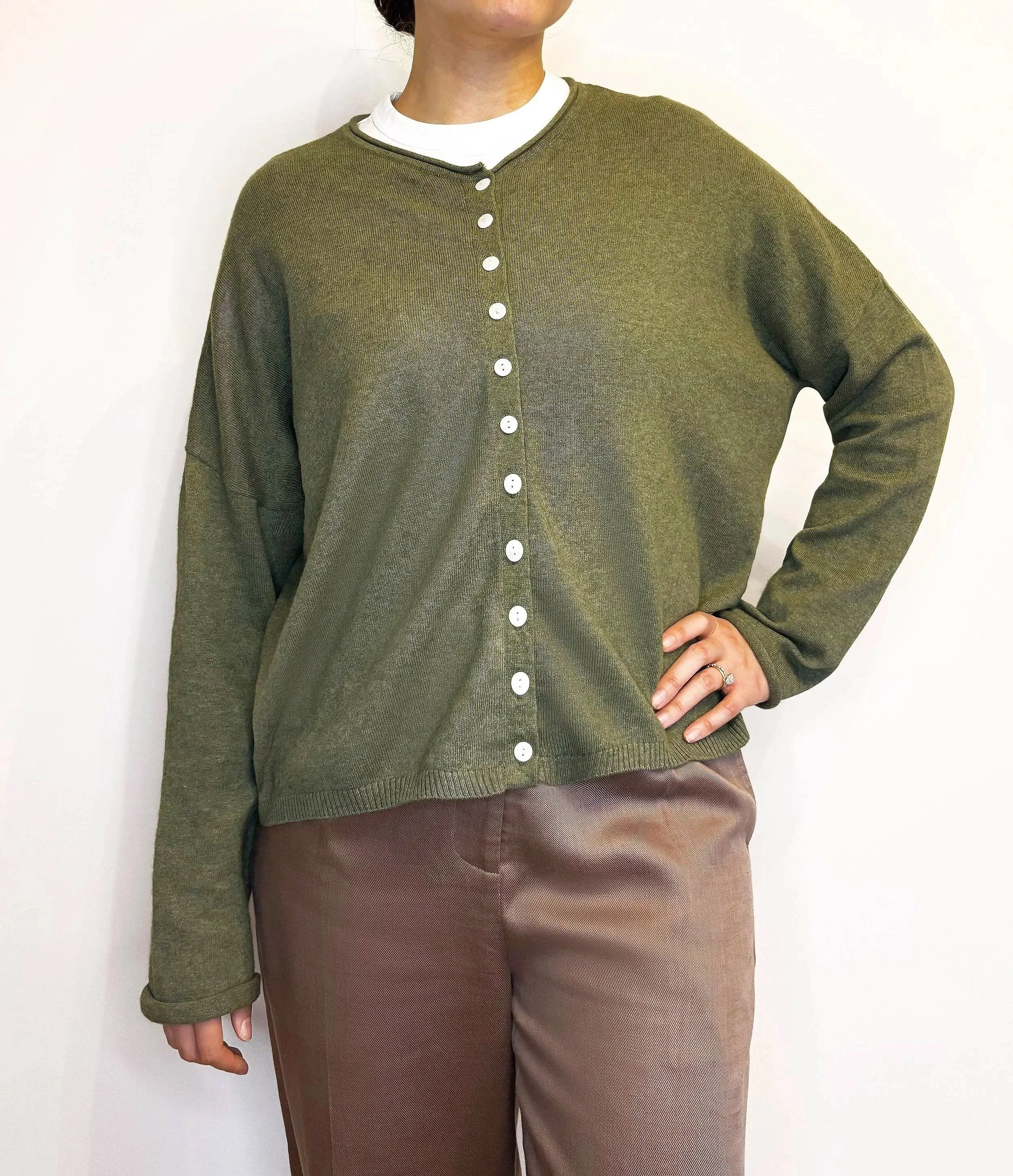 Olive green boxy-fit women’s knit cardigan, loose relaxed fit, made from sustainable wool and cotton fibres