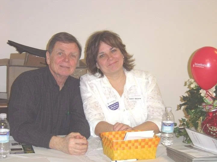 Nancy Maupin, a licensed agent in Spokane, at a Medicare event with her husband George Maupin.