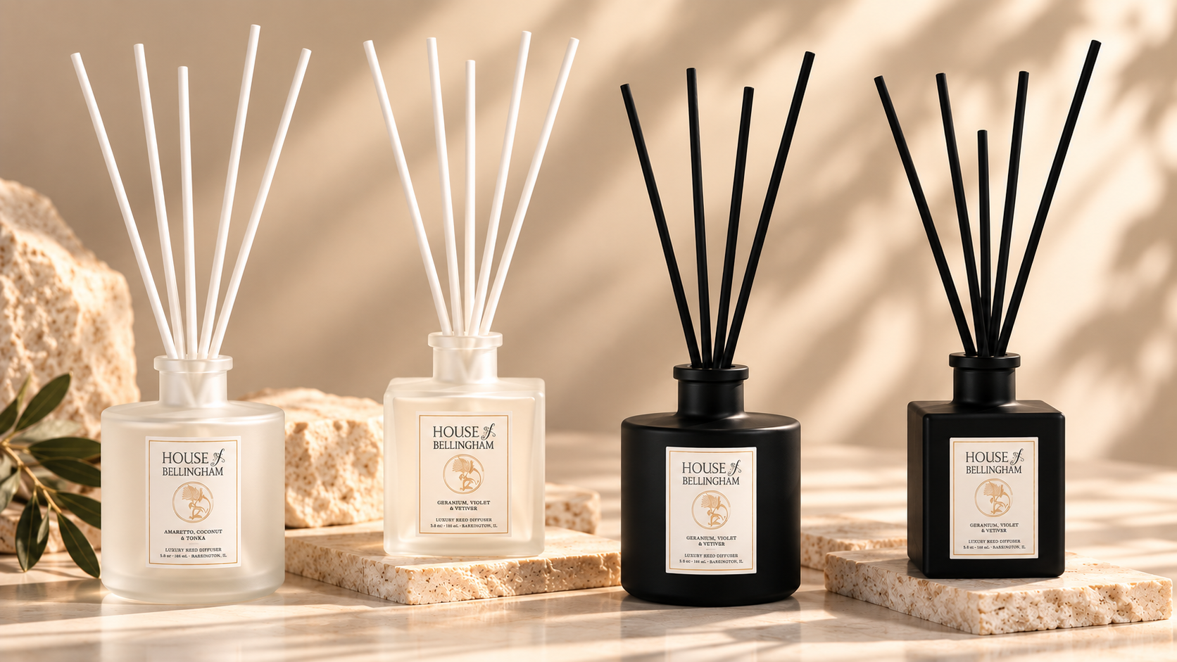 House of Bellingham luxury reed diffusers in frosted white and matte black finishes.