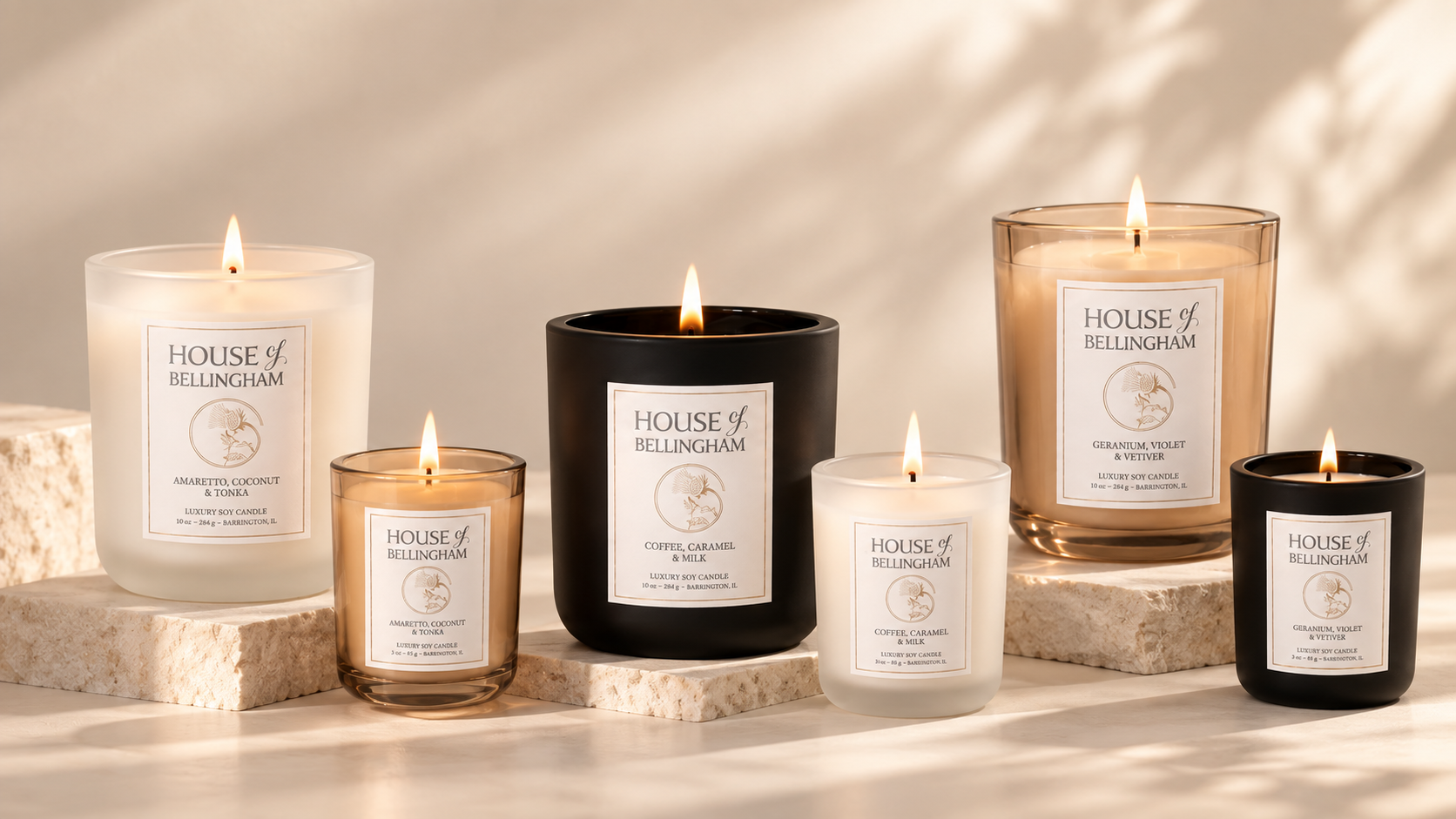 House of Bellingham luxury scented candles in frosted white, matte black and champagne glass finishes.