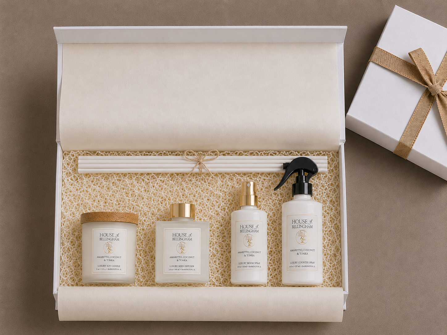 Open white gift box featuring The Layering Collection - Petite - from House of Bellingham with a luxury soy candle, reed diffuser, room spray, countertop spray, diffuser reeds, and a ribboned gift box.