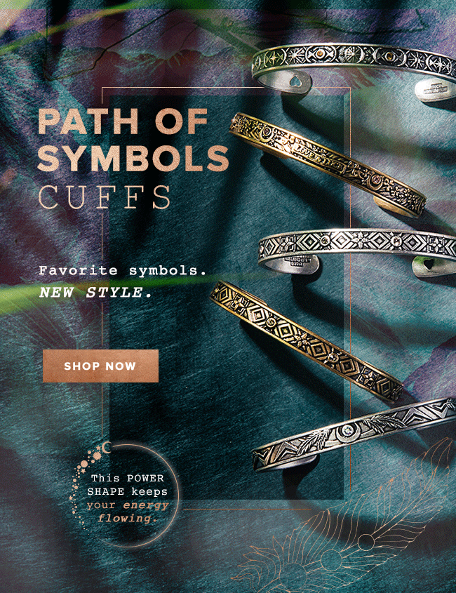 Multiple metal cuff bracelets with various engraved symbols, displayed on a colorful, textured fabric background, with text promoting the products as the new style for accessories.