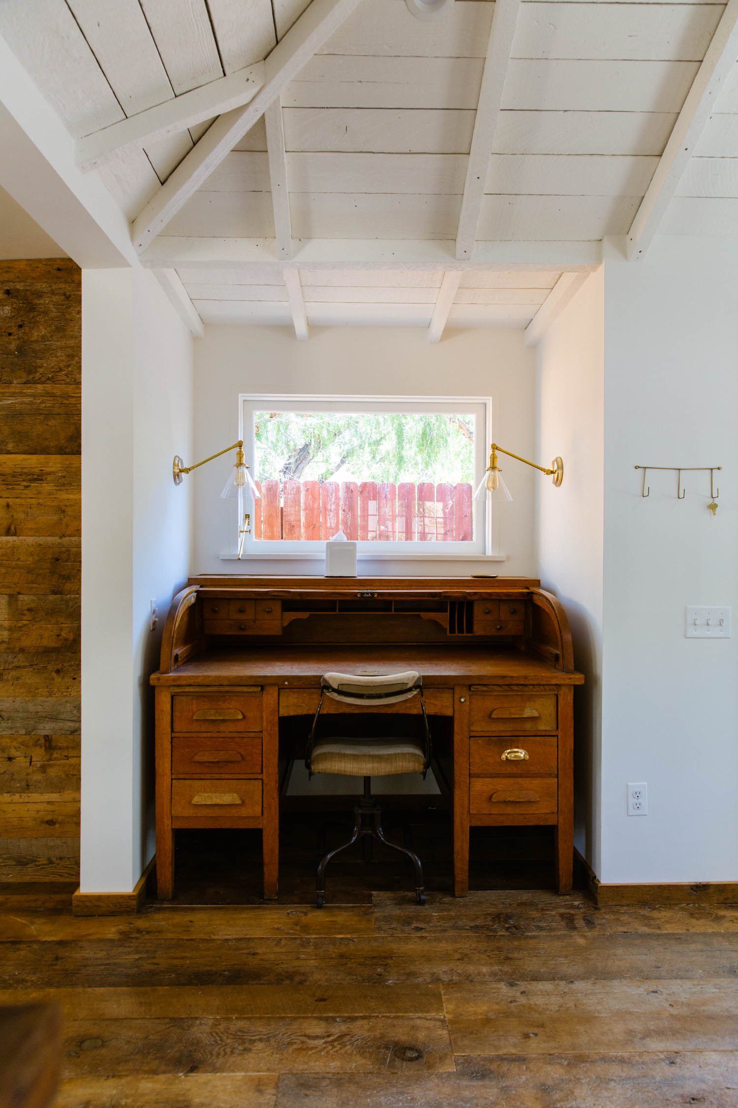 Interior by Lawren Howell with vintage desk and lighting