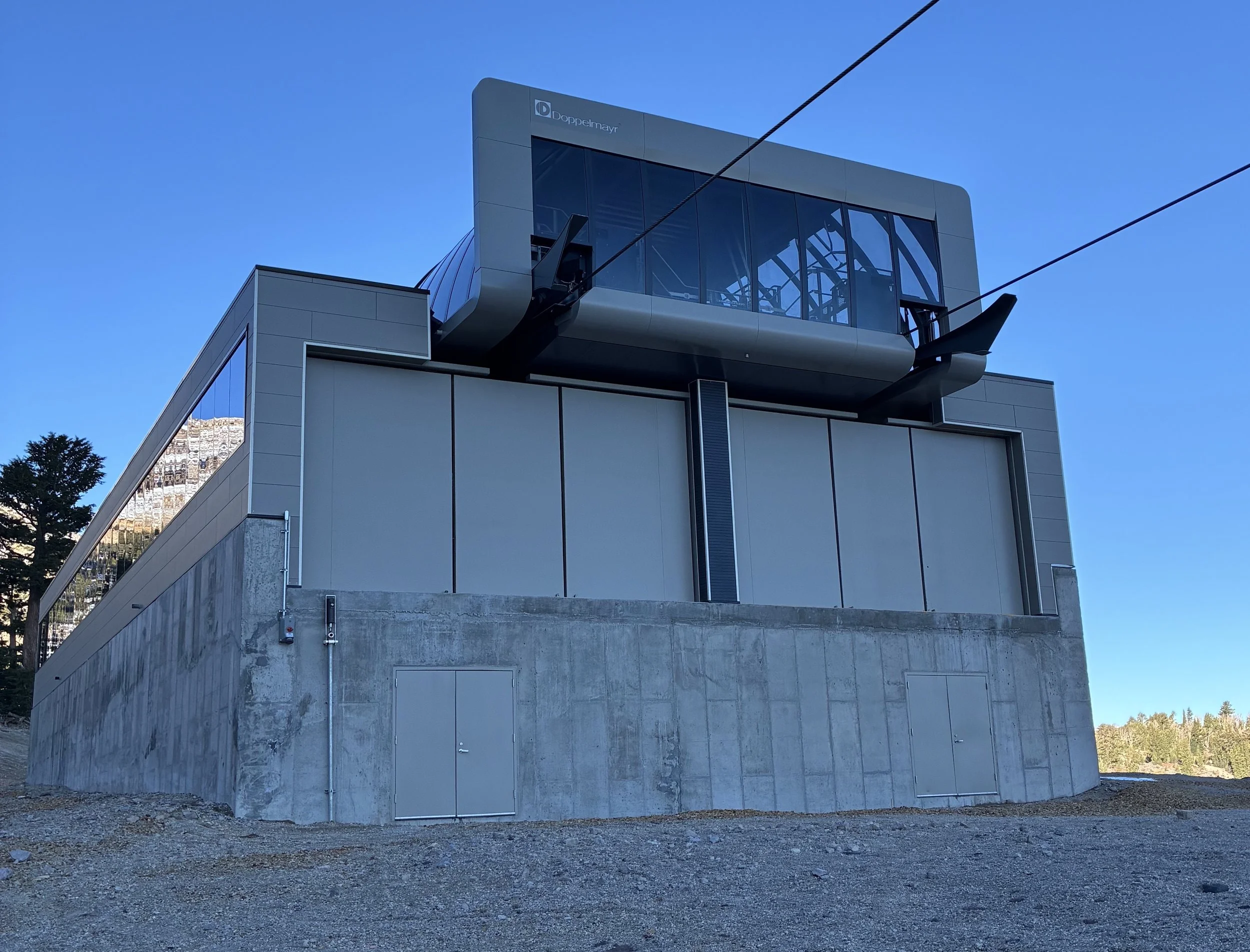 Storm doors, new CH16 and new CH1, each door measures 12' tall by 8' wide. completed under employment of Mammoth Mountain Ski Area. Scope: Design, fabrication, and installation of doors, custom bearing hinges, and lock mechanisms. Building and chairl