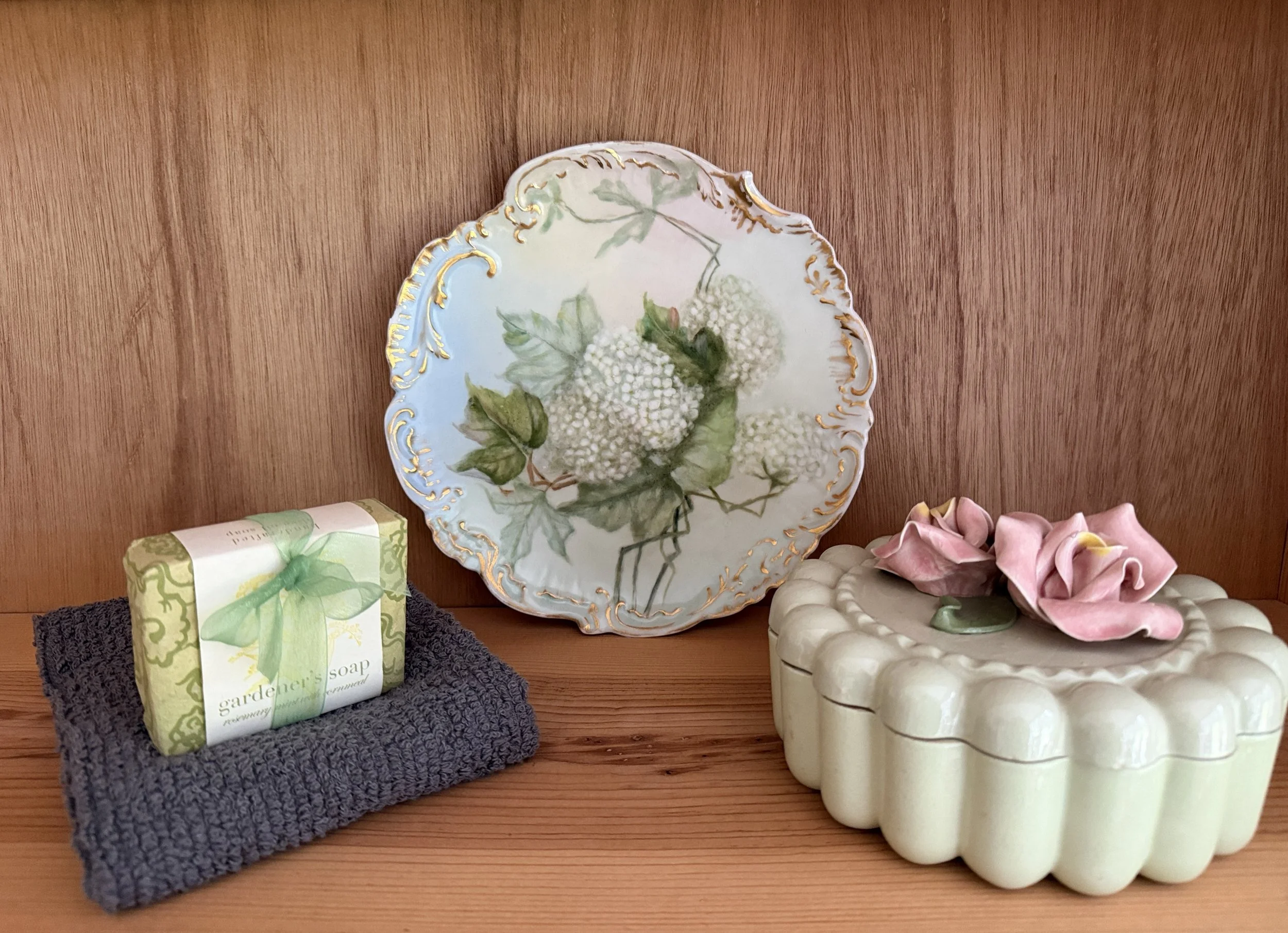 Hydrangea plate on a shelf with soap